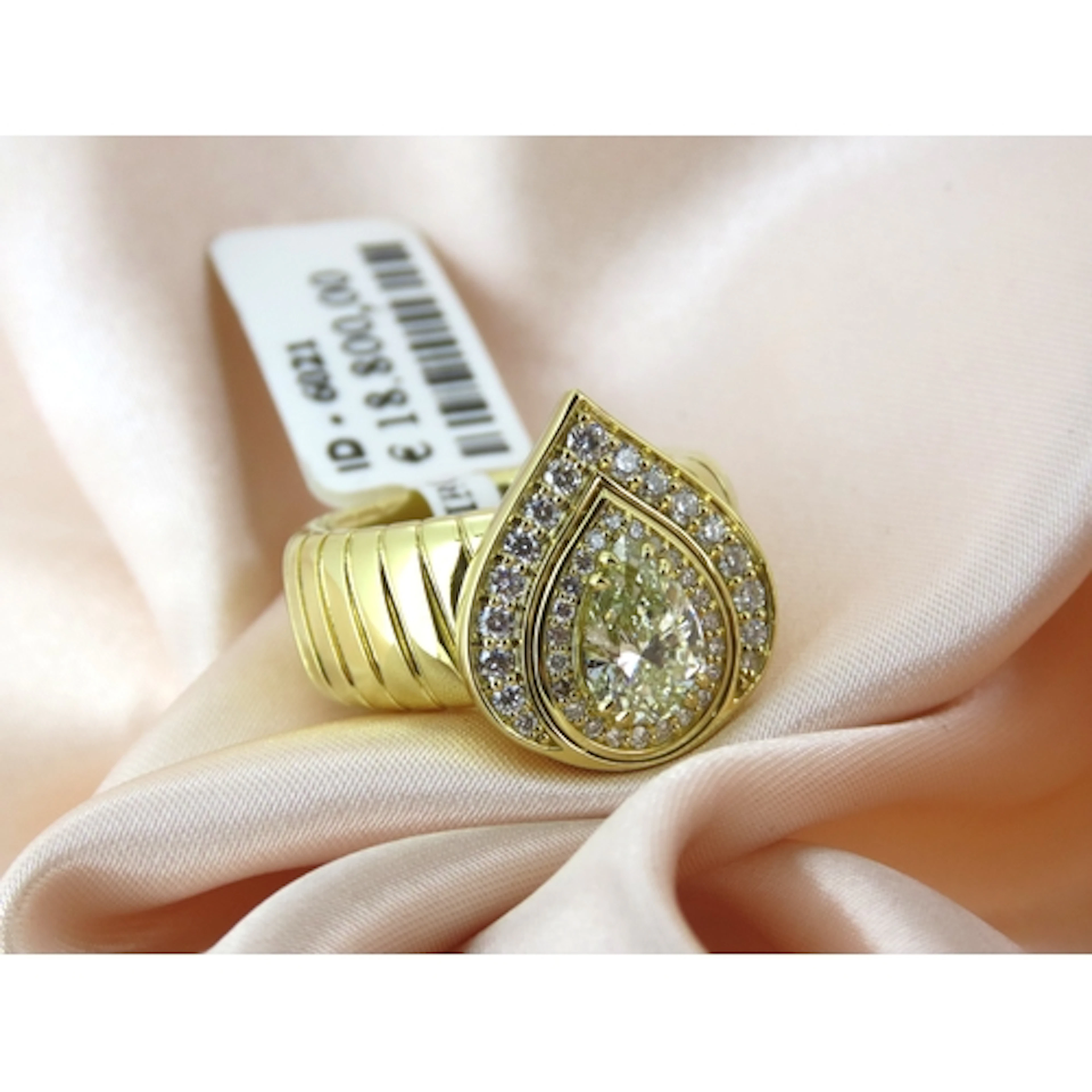 Attractively Detailed, Pear Cut Diamond Centre Stone Tubogas...