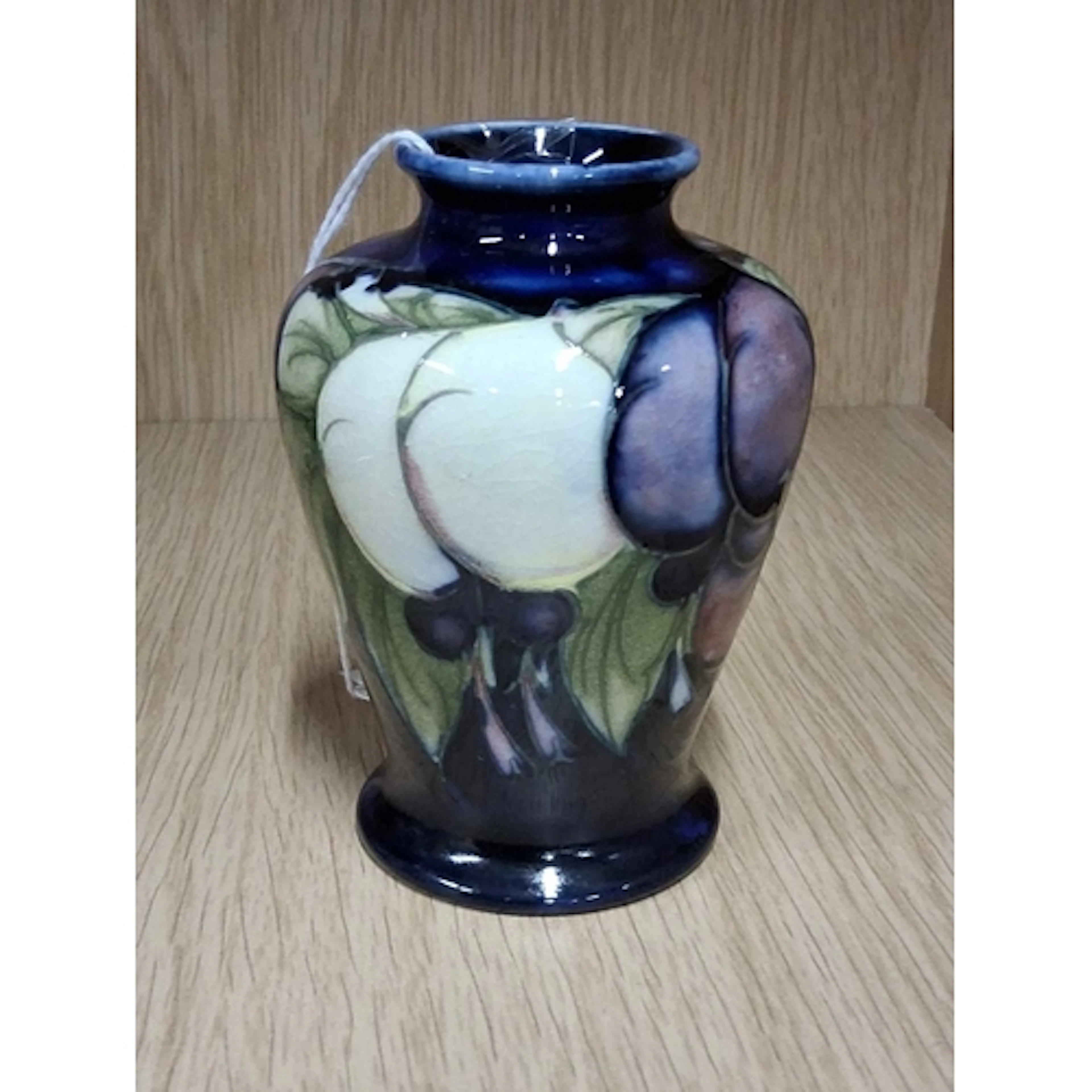 A MOORCROFT POTTERY WISTERIA VASE, of baluster form, tube-li...