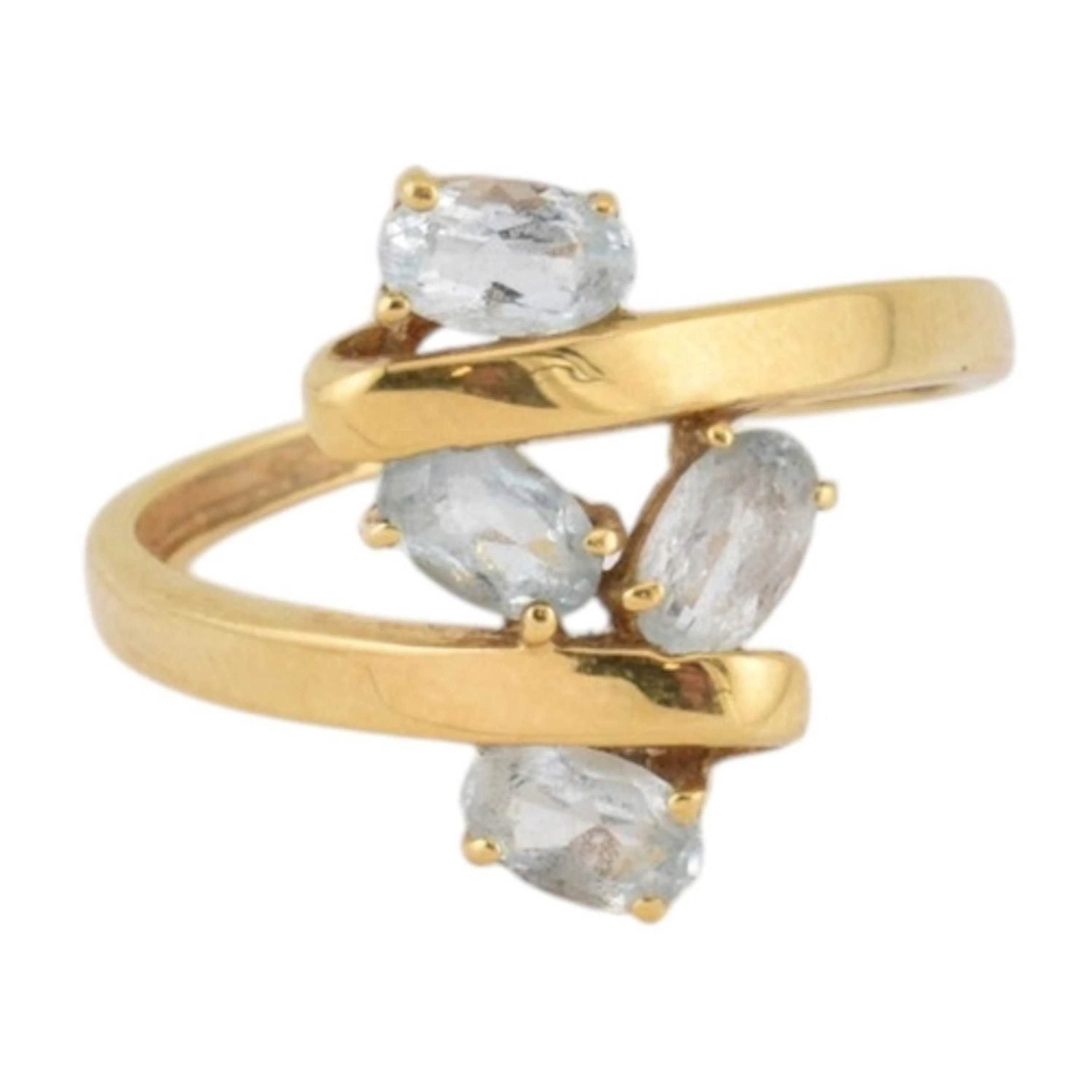 An 18ct gold and aquamarine cluster ring. Stamped 750. Conti...