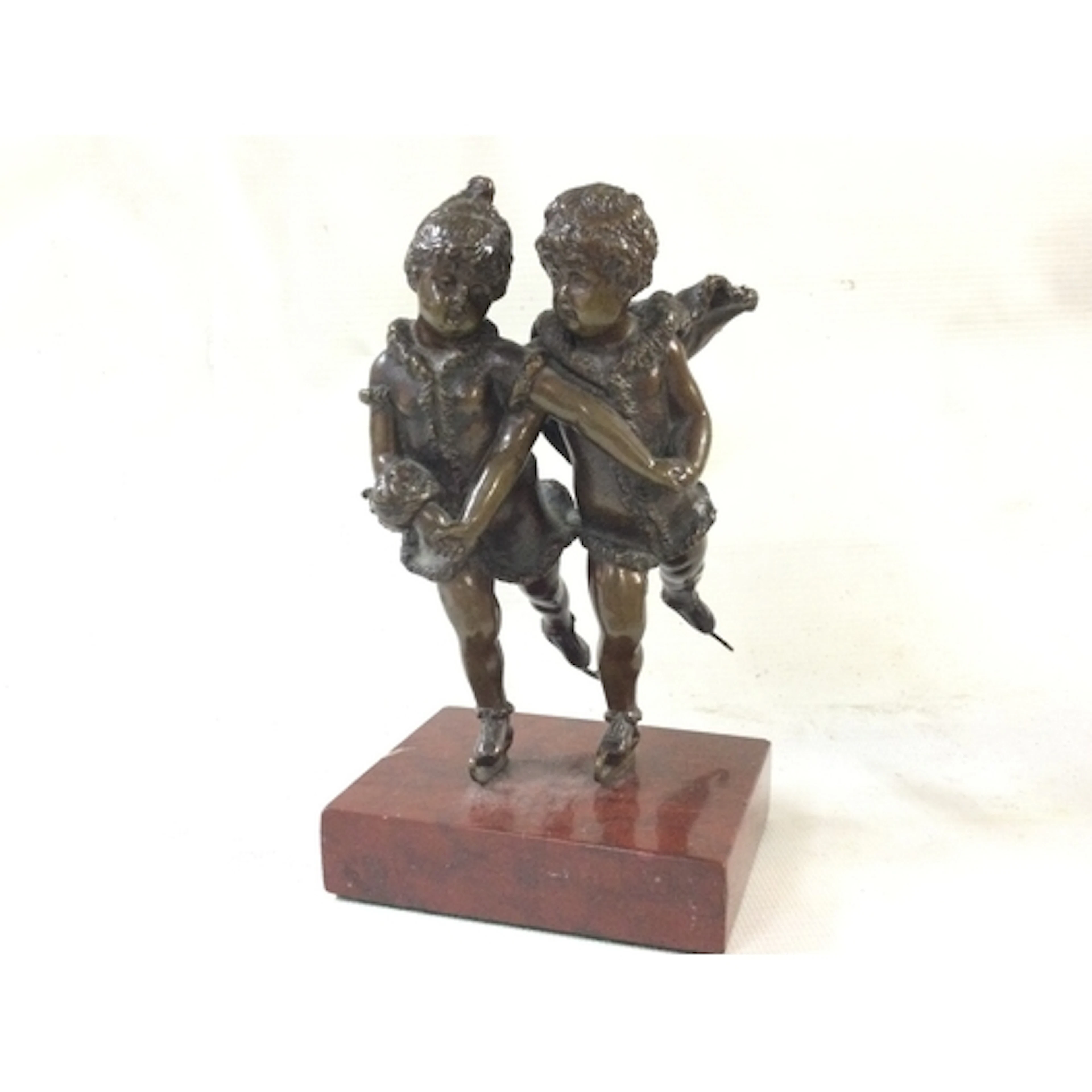 A small bronze early 20th century skating figure on a marble...