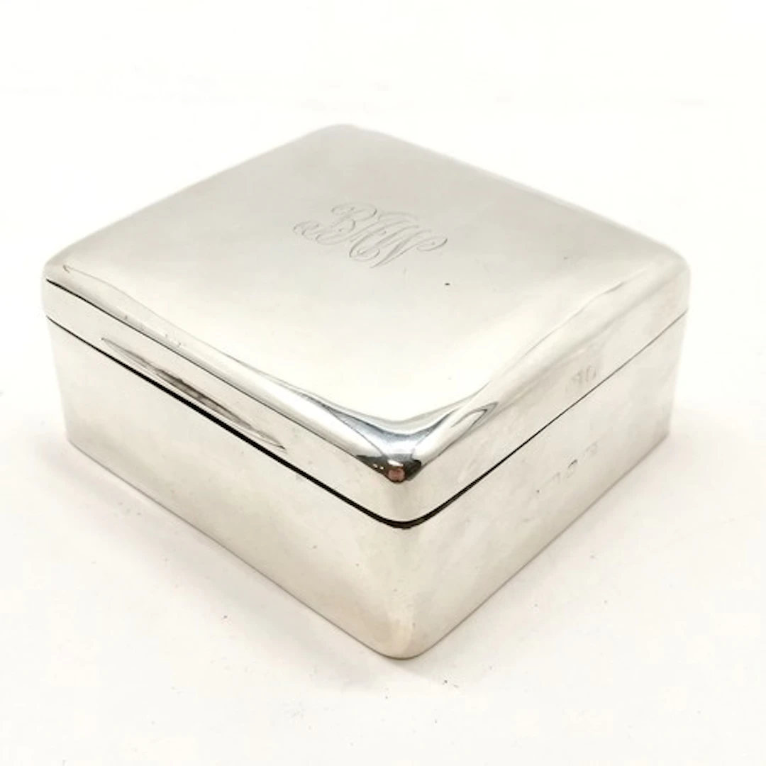 Silver hallmarked cigarette box with wooden liner and weight...
