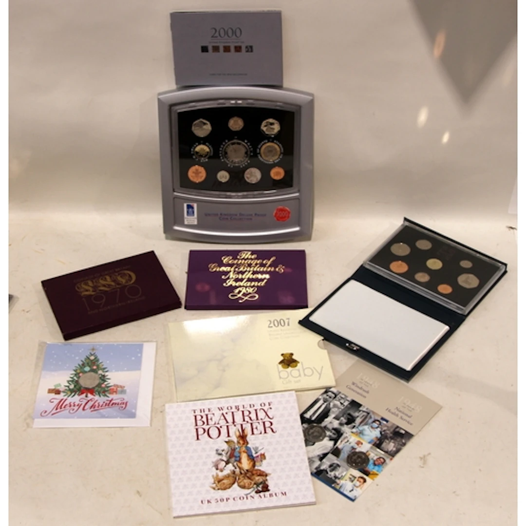 Royal Mint GB issue coin sets to include 2000 UK Deluxe Proo...