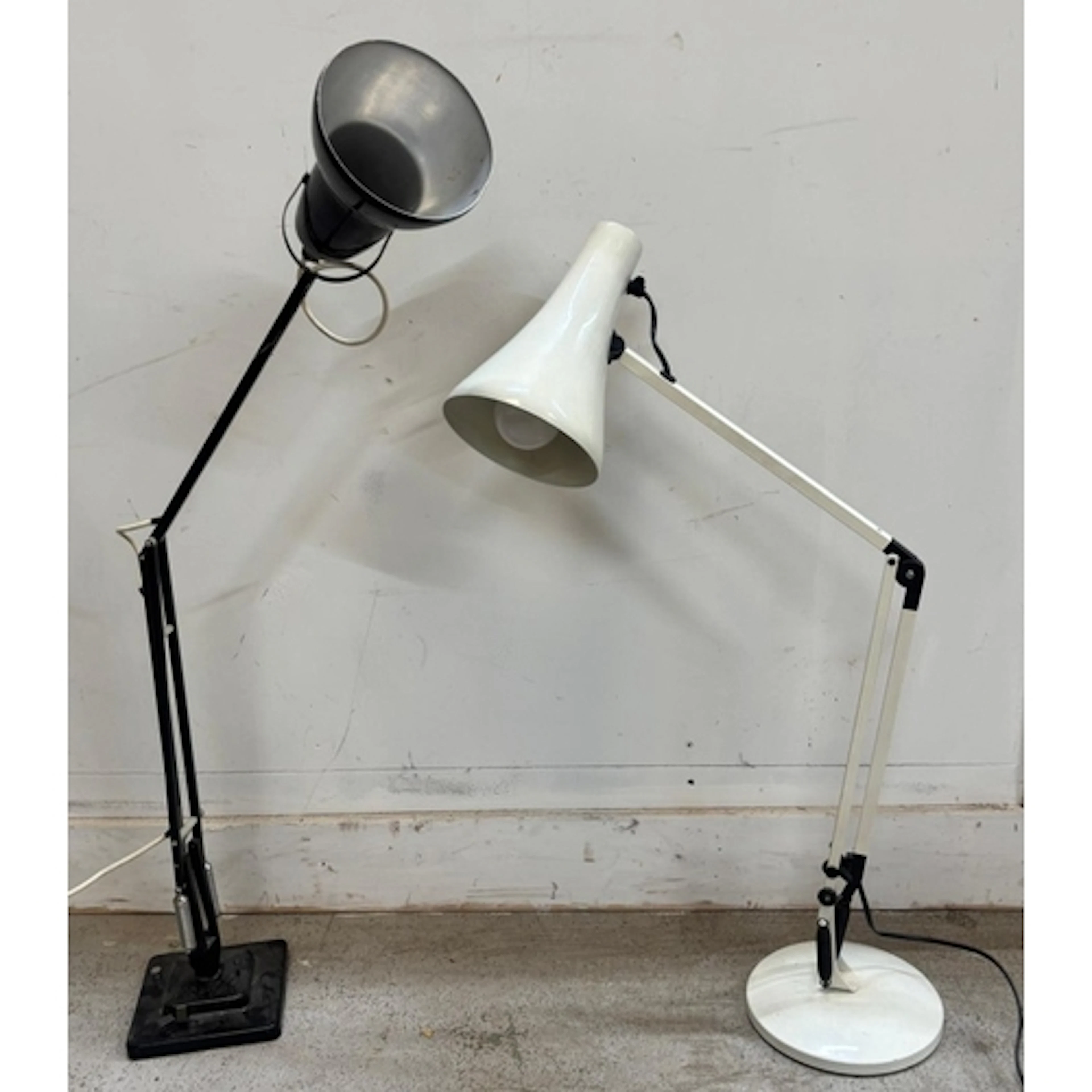 Two Anglepoise desk lamps with adjustable arms, one white an...