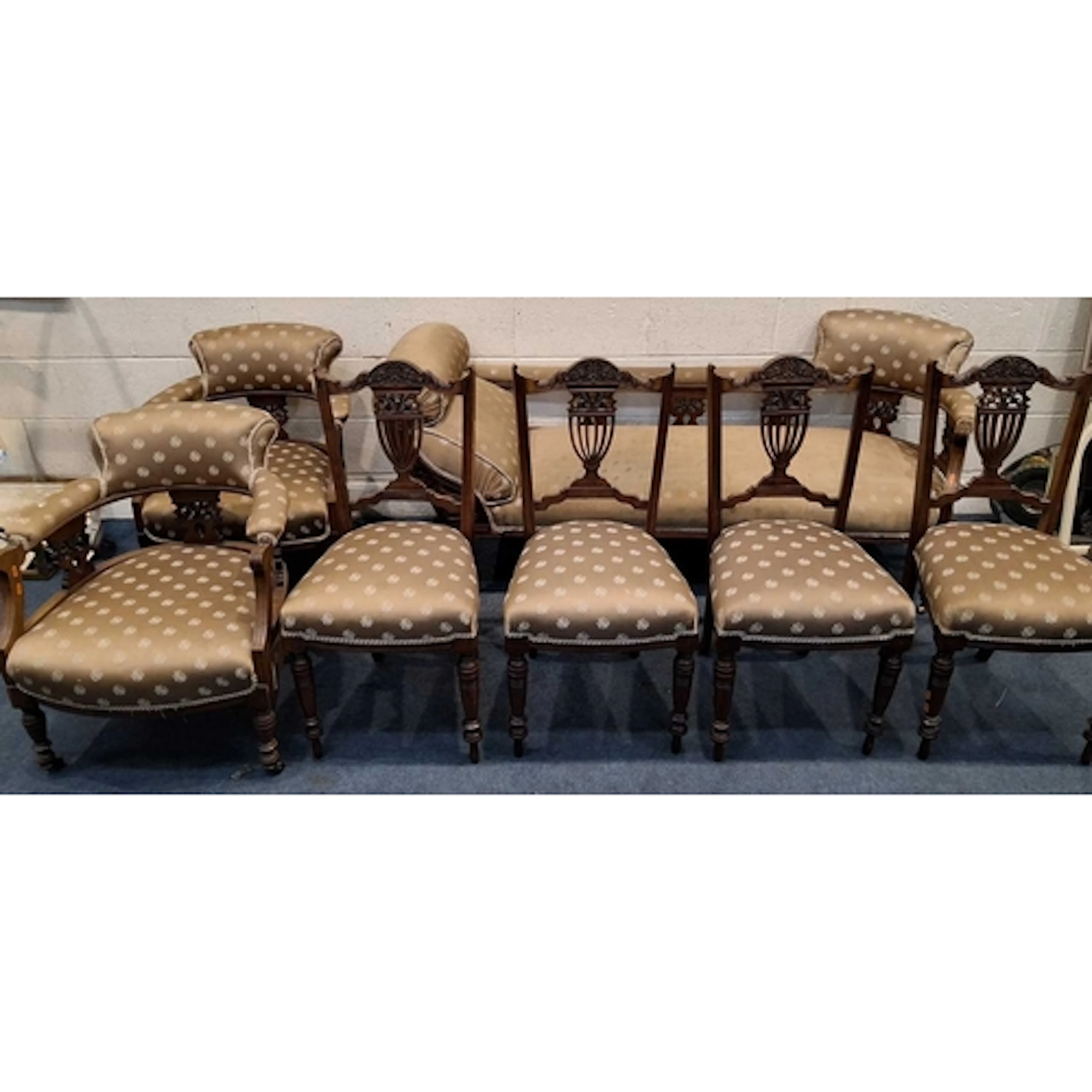 AN EDWARDIAN WALNUT PARLOUR SUITE, comprising a chaise longu...