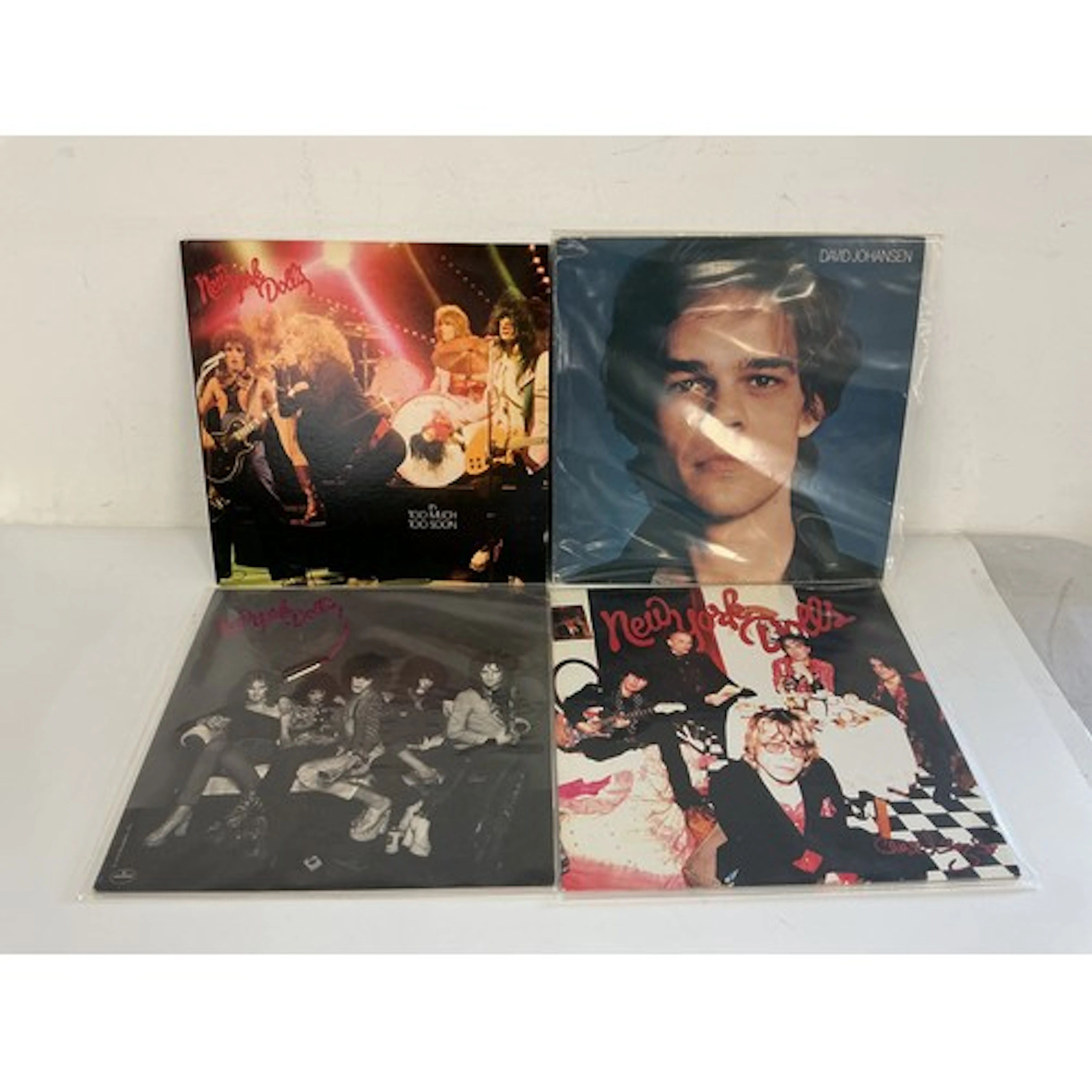 Four New York Dolls and related LPs comprising a 180g pressi...