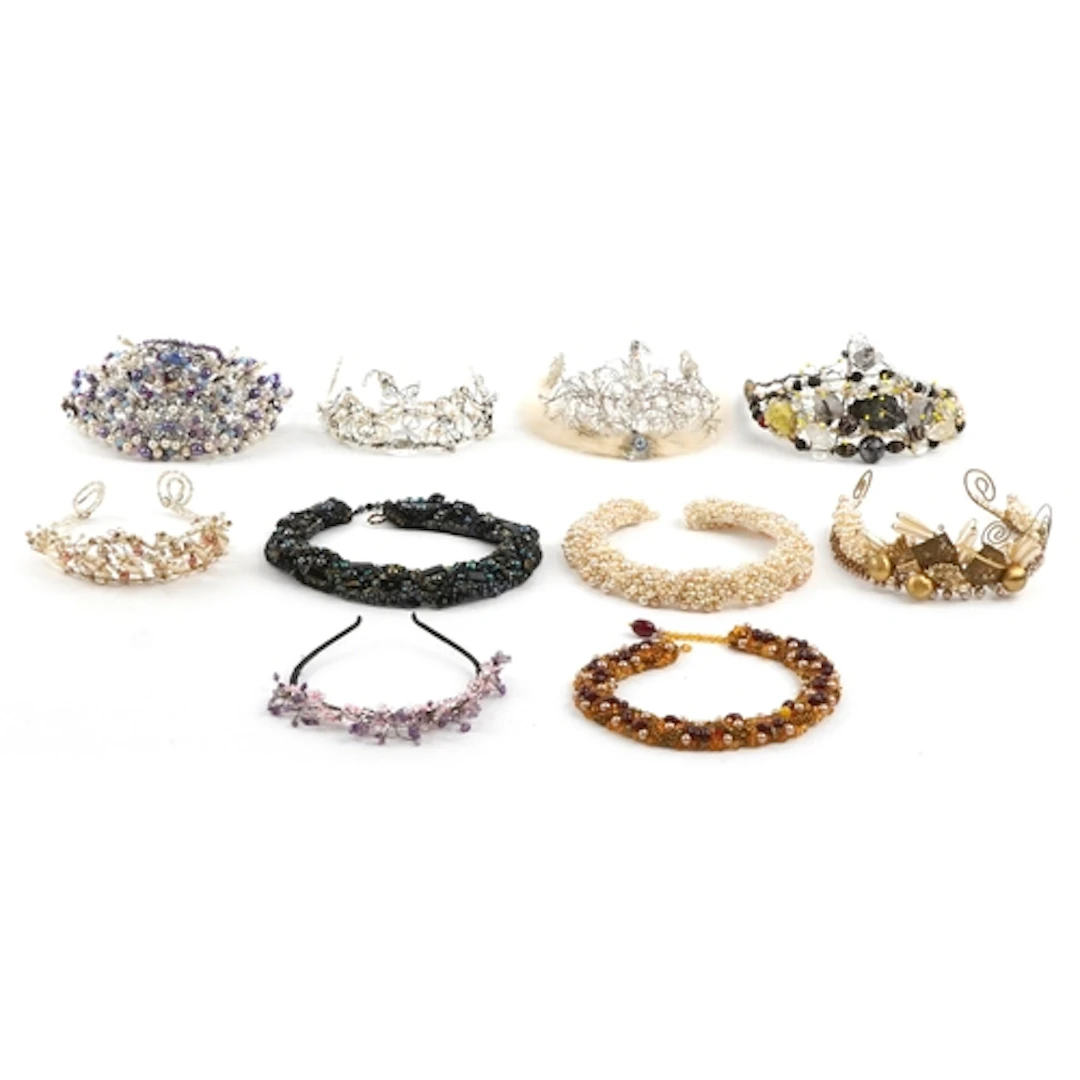 Collection of handmade bead tiaras/crowns, predominantly sim...