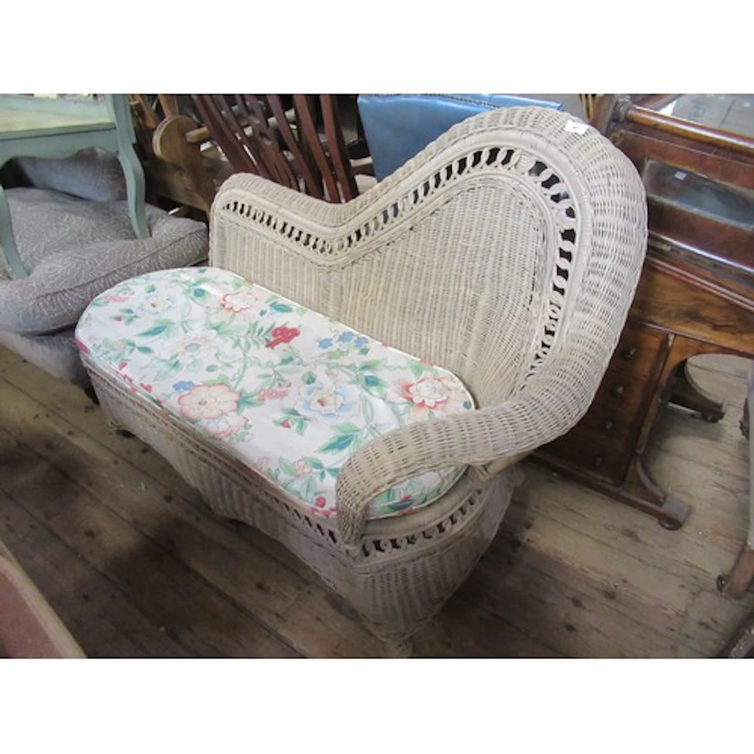 A conservatory canned chaise longue together with a modern e...