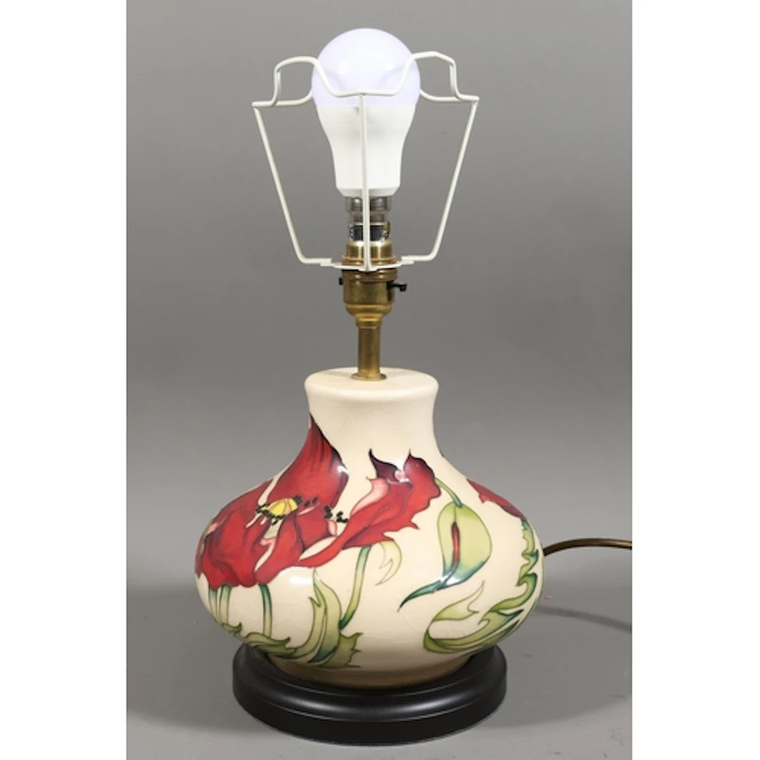 Moorcroft table lamp decorated with poppies, over cream glaz...