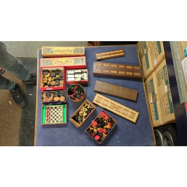 A collection of tabletop games comprising wooden cribbage bo...