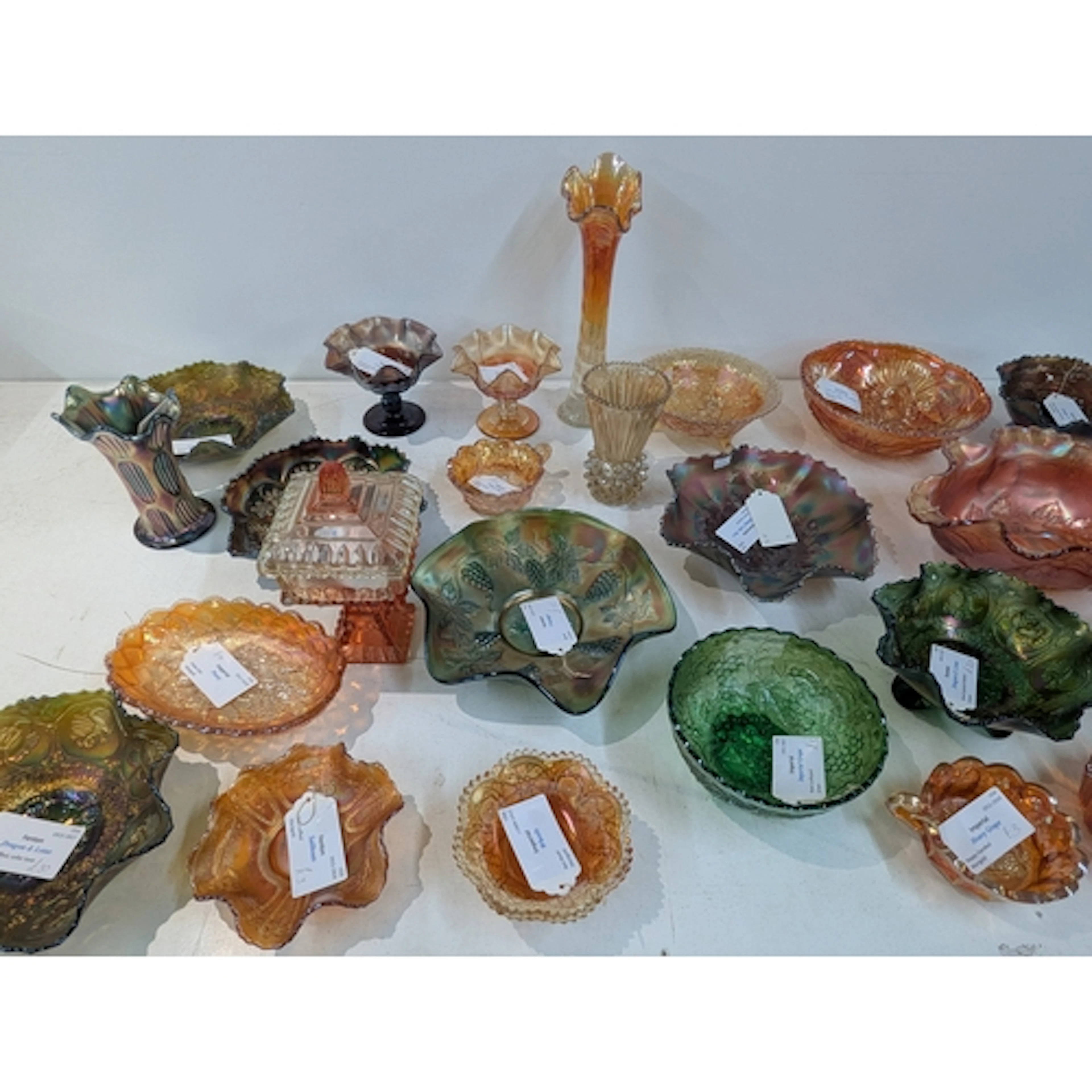 A collection of carnival glass to include a Fenton Dragon an...
