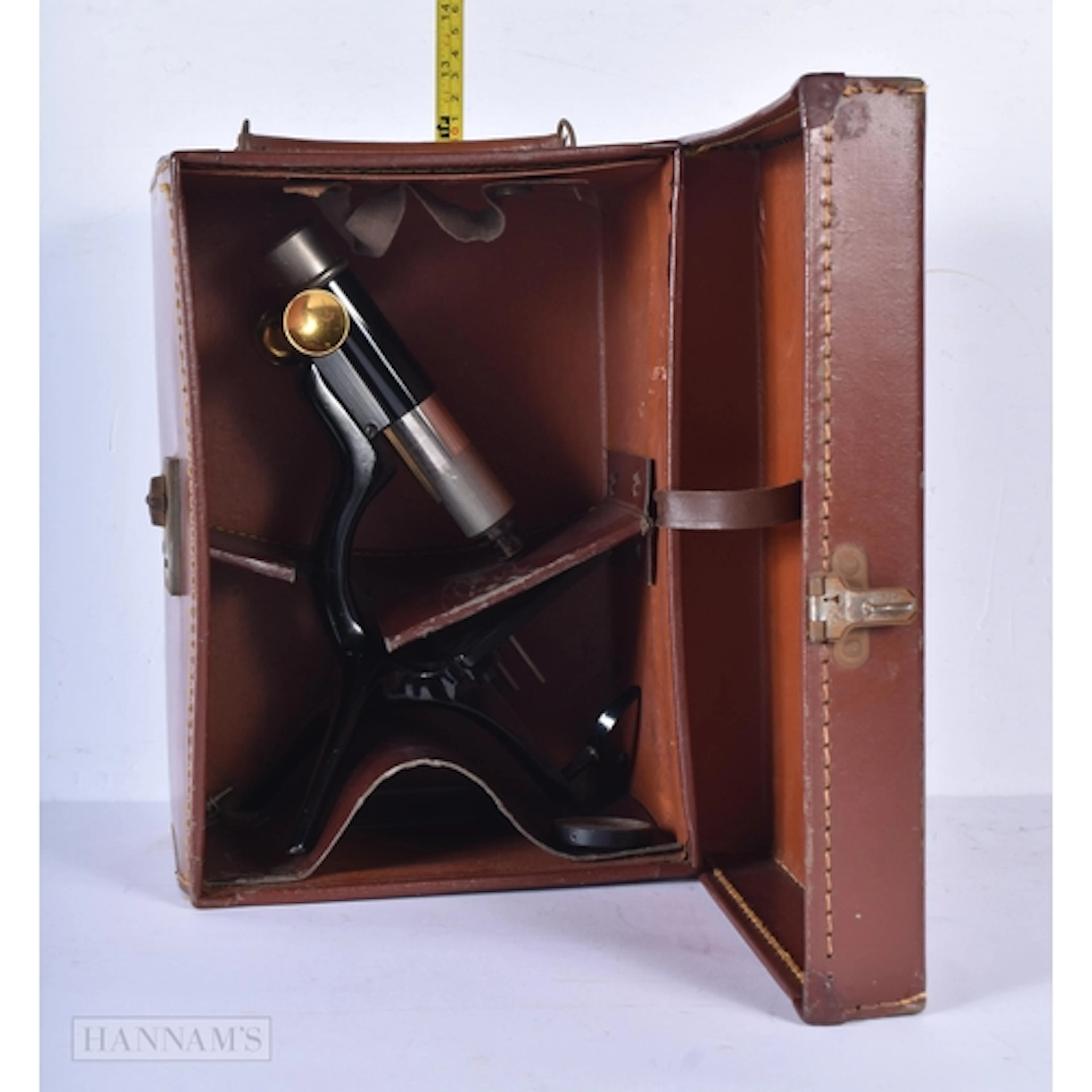 A vintage leather cased W & S microscope 14 x 29 x 21cm