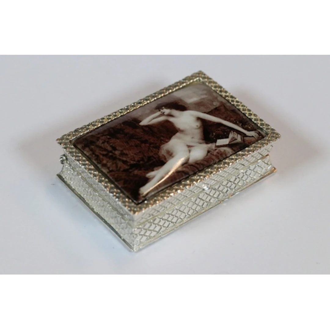 Silver plated pill box with ceramic nude figure on the lid