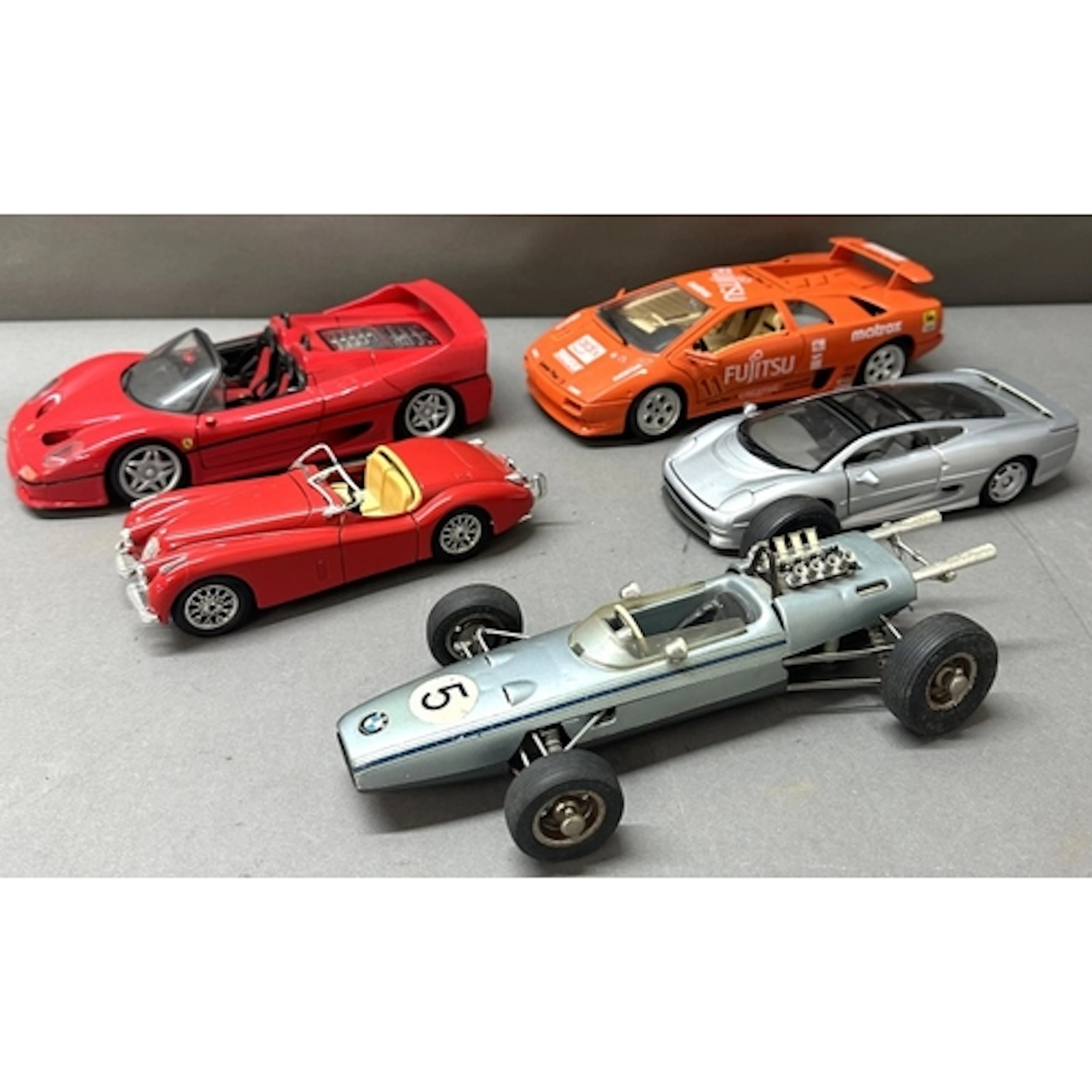 A selection of diecast model cars to include a Burago Jaguar...