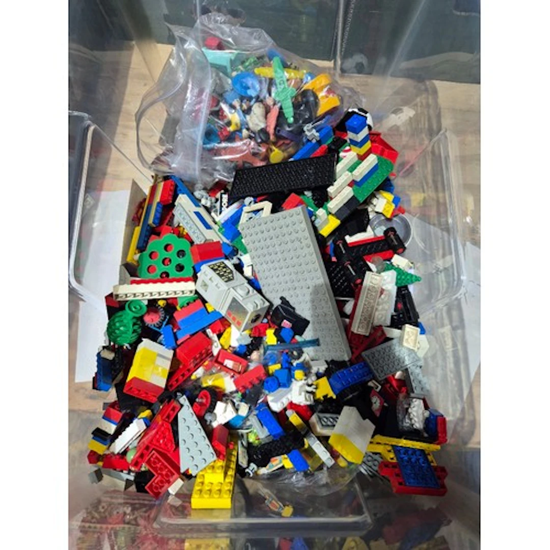 A box of assorted lego & vintage toys.