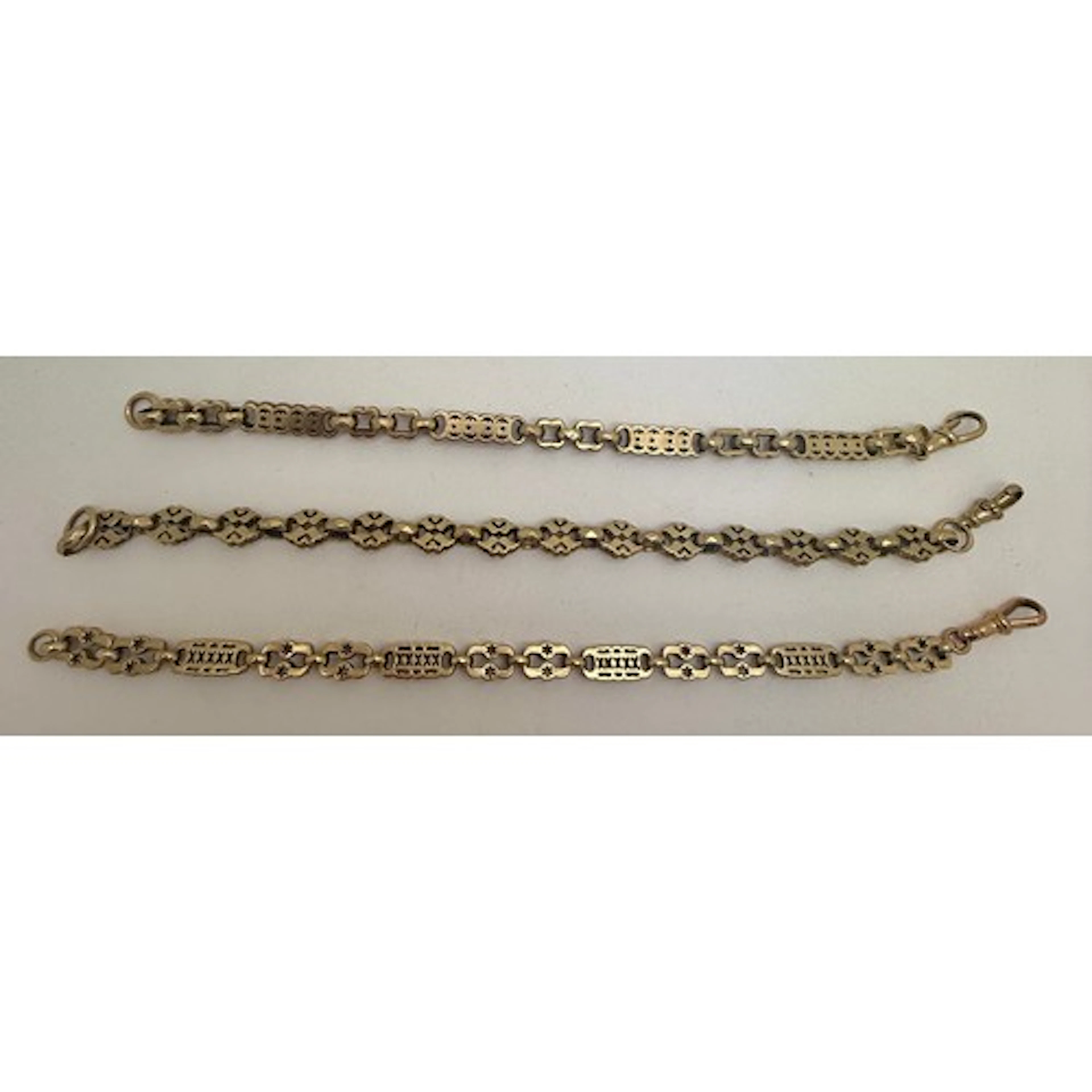 Three 9 carat gold chain bracelets. Length 21.5cm, 22cm, 20c...