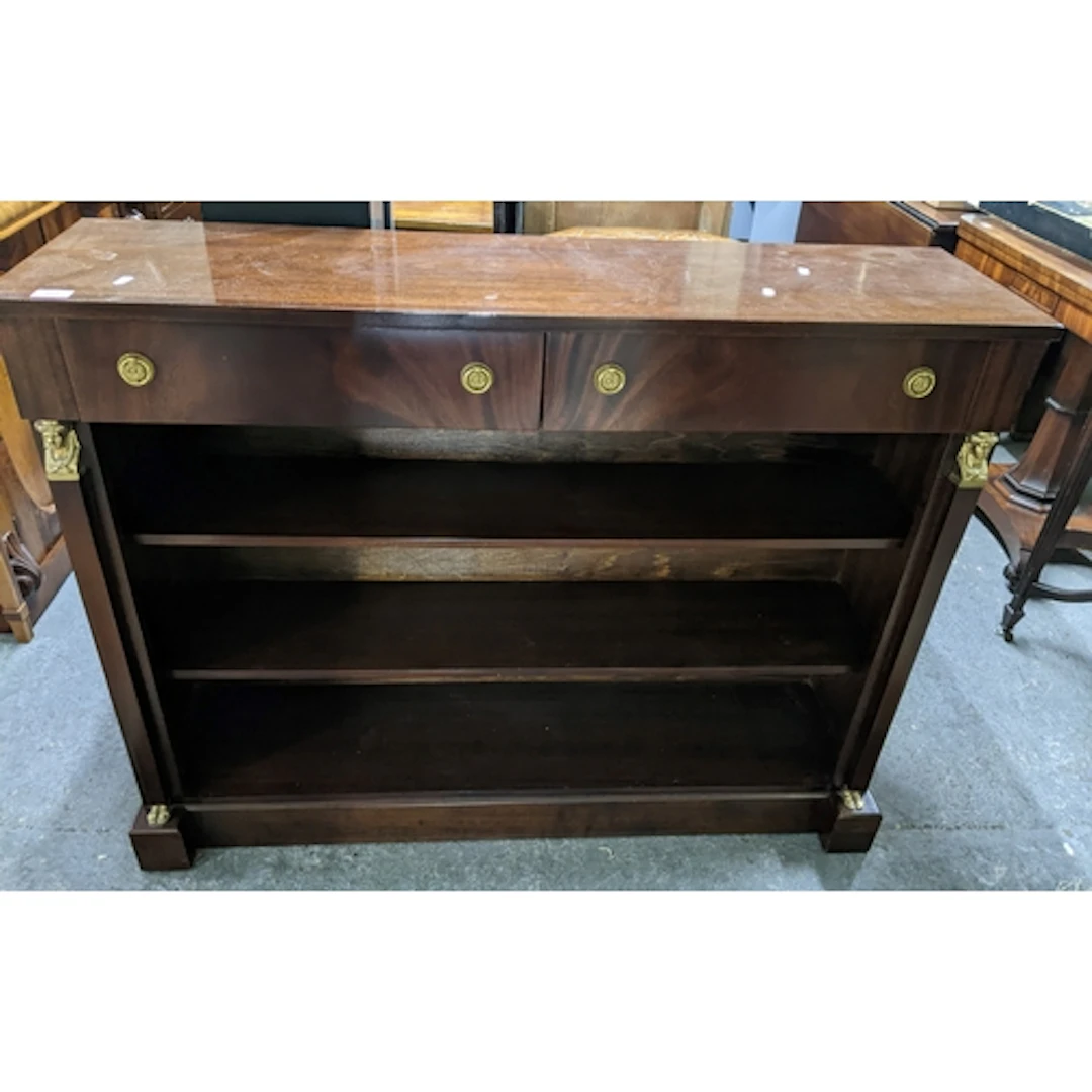 A reproduction mahogany Egyptian revival style open bookcase...