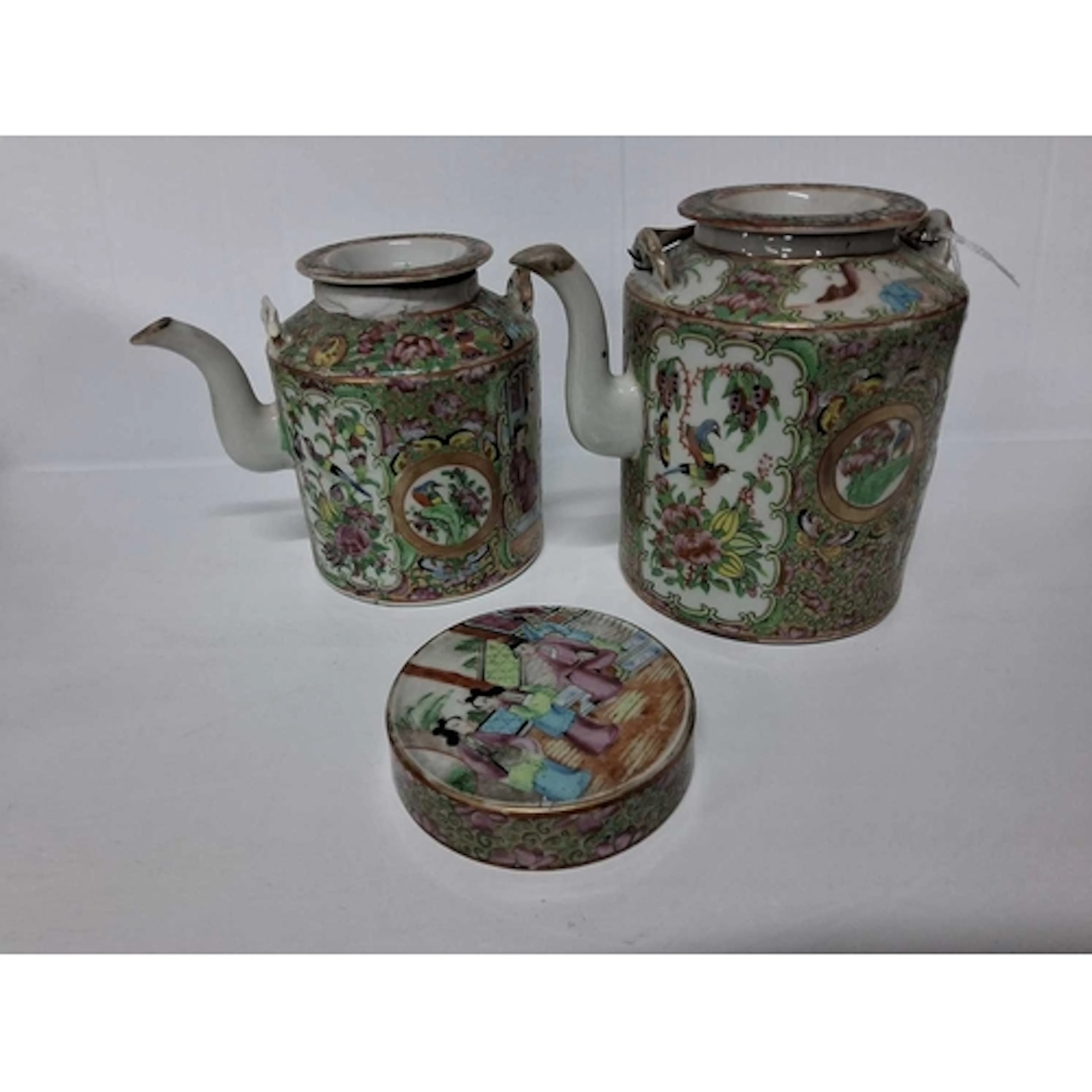 TWO CHINESE FAMILLE ROSE TEAPOTS, painted with panels of fig...