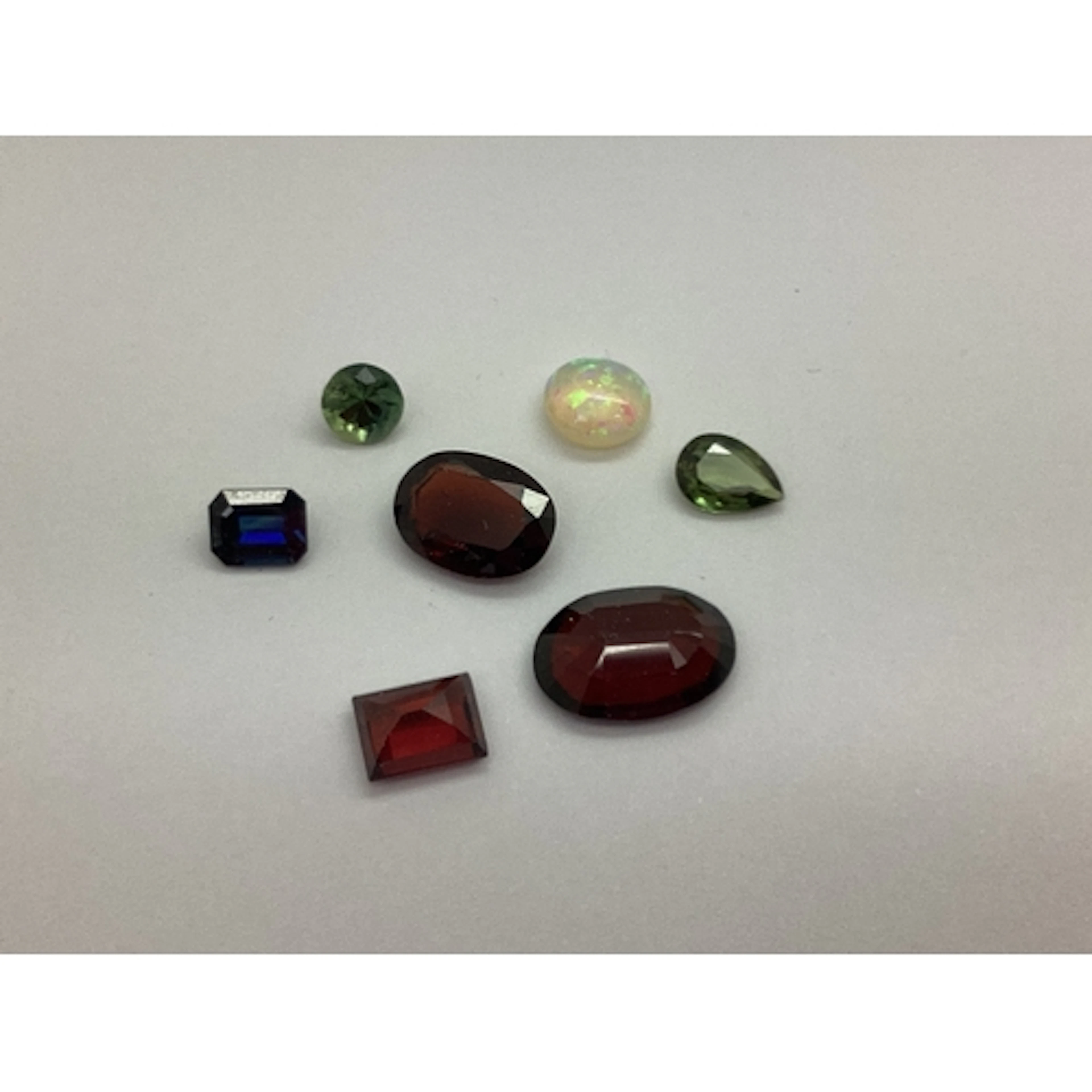 Unmounted Circular Cabochon Opal, (7mm) with note 'Opal from...
