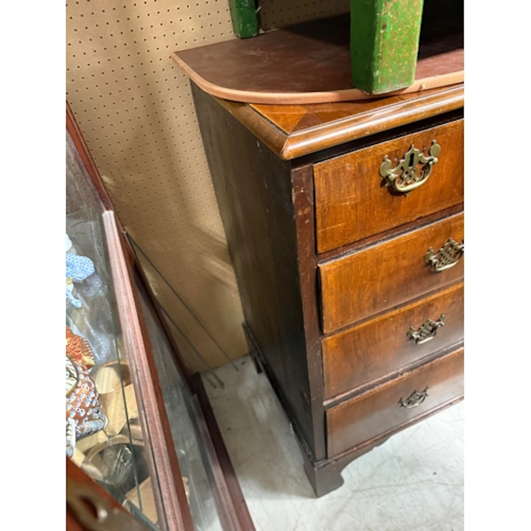 A QUEEN ANNE AND LATER WALNUT CHEST OF DRAWERS With oak side...