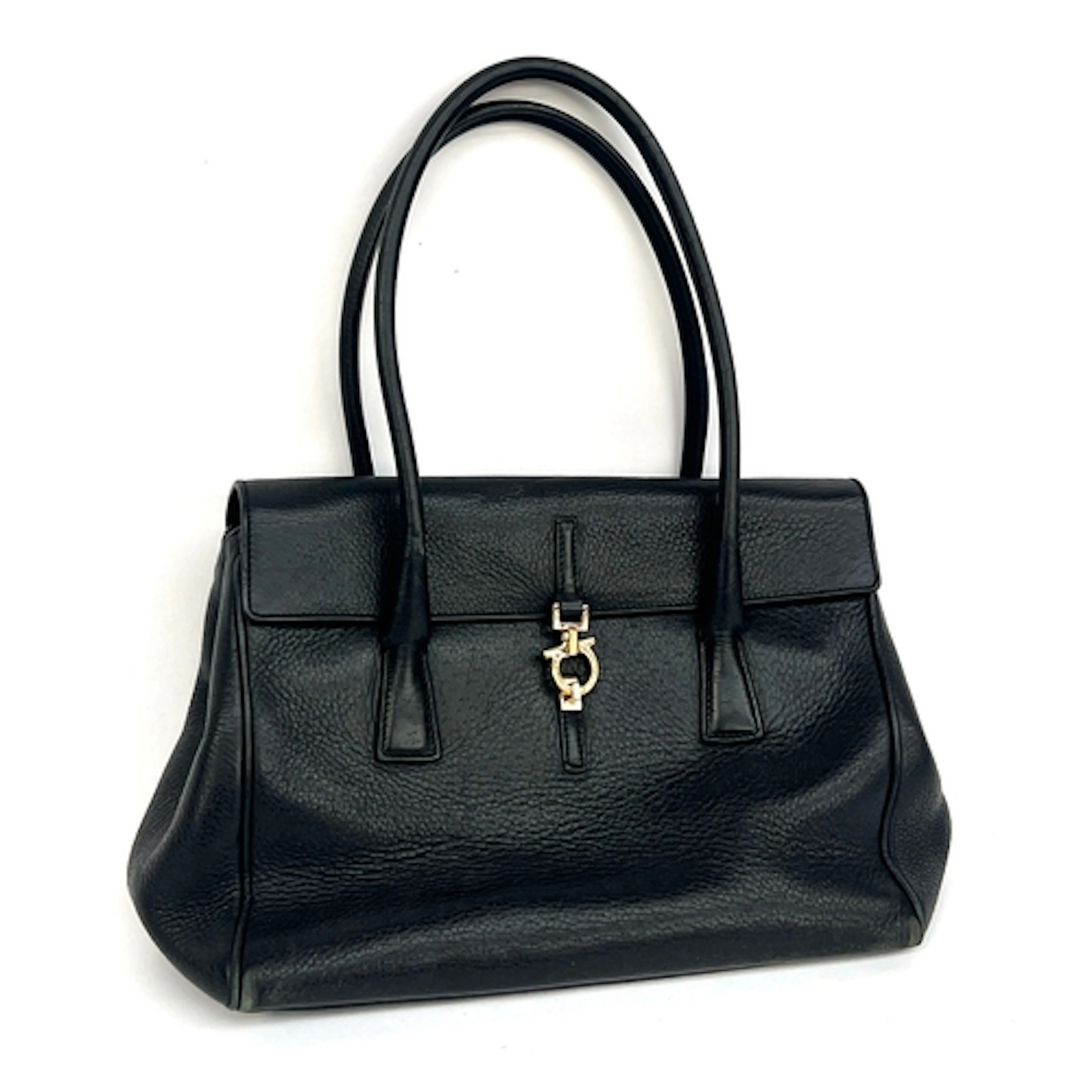 A Salvatorre Ferragamo black leather handbag, fastening with...