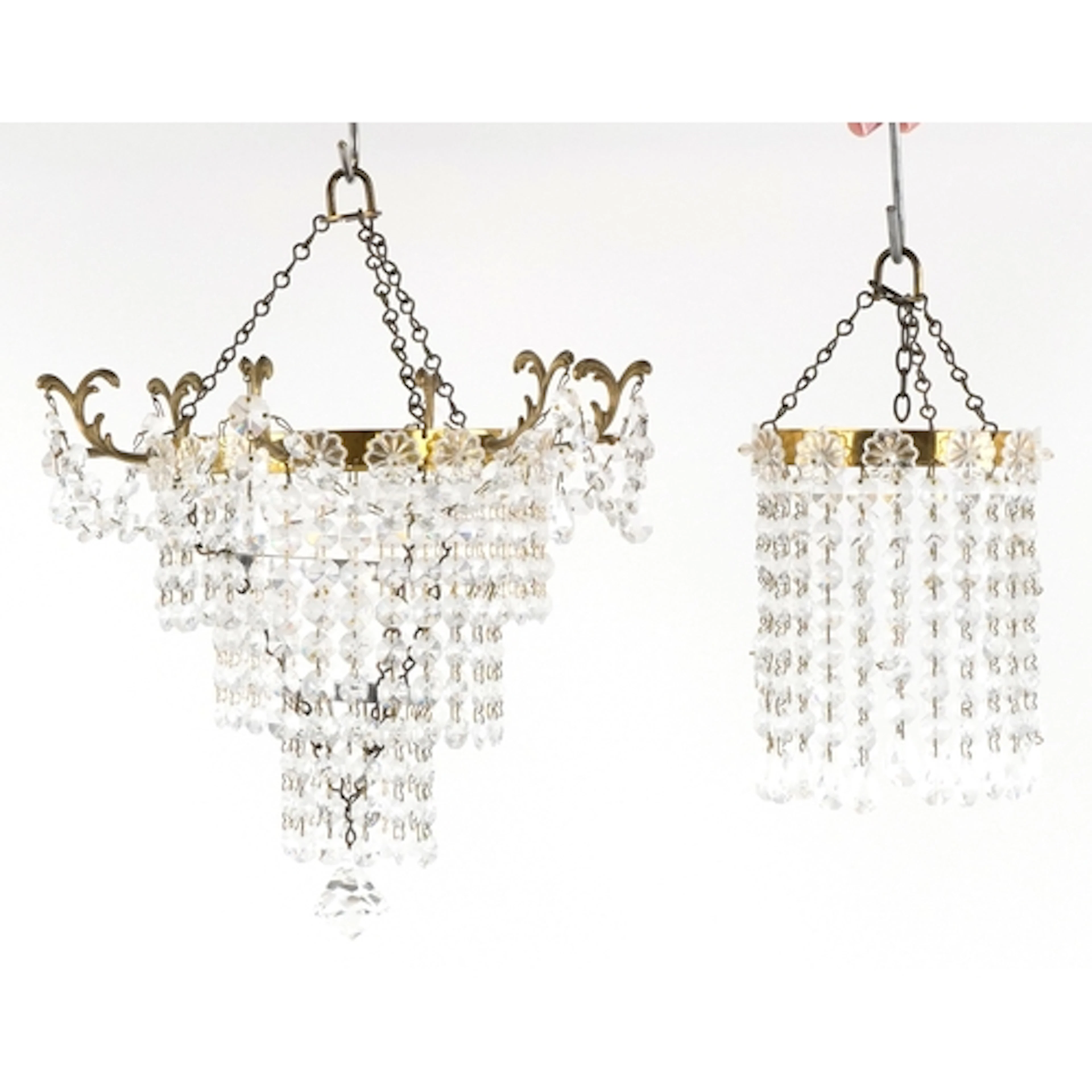Two vintage gilt brass and cut glass chandeliers, the larges...