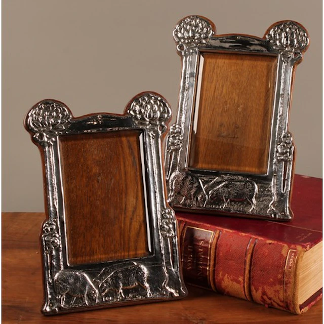 An associated pair of Arts & Crafts silver easel photograph ...