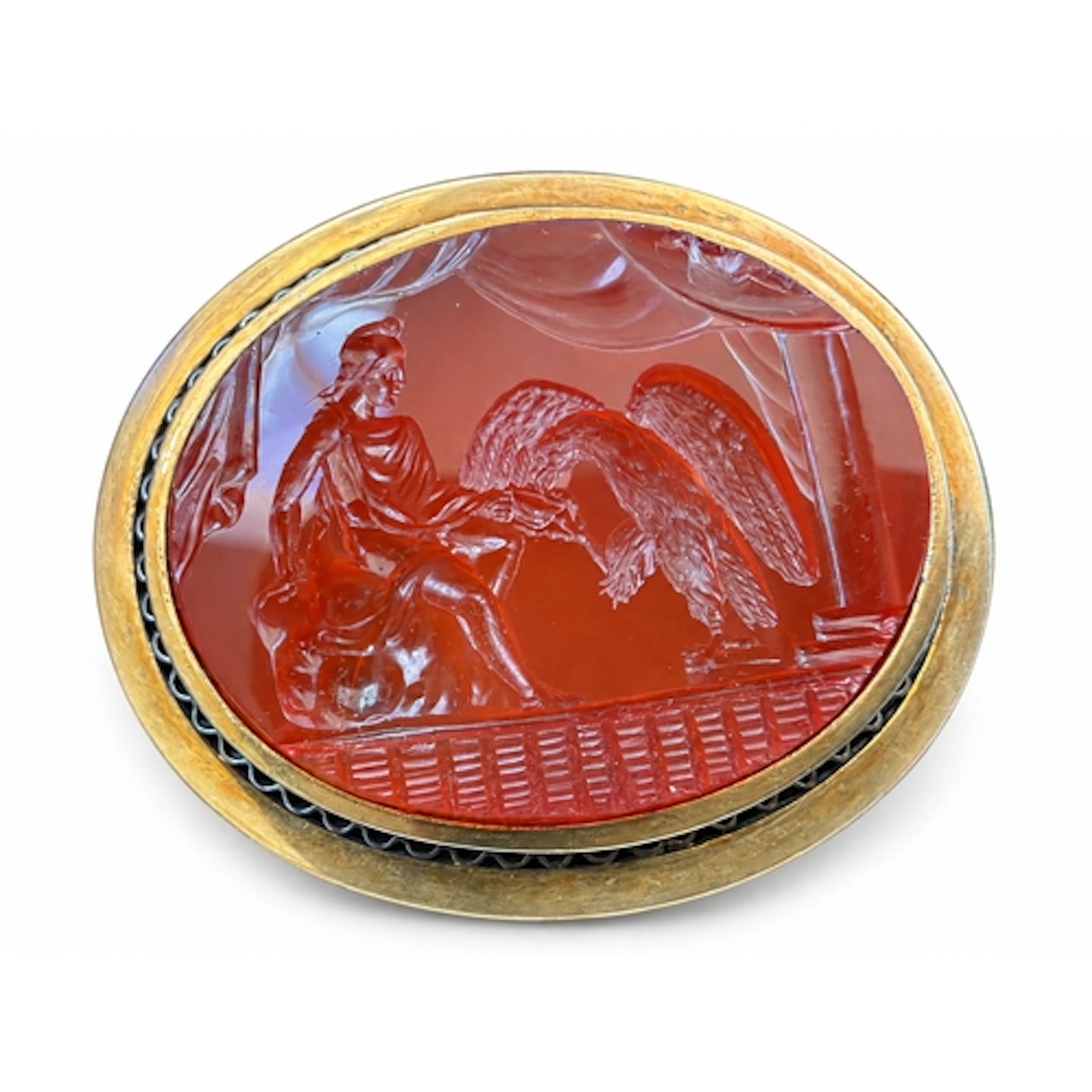 An impressive oval carnelian intaglio brooch depicting Ganym...