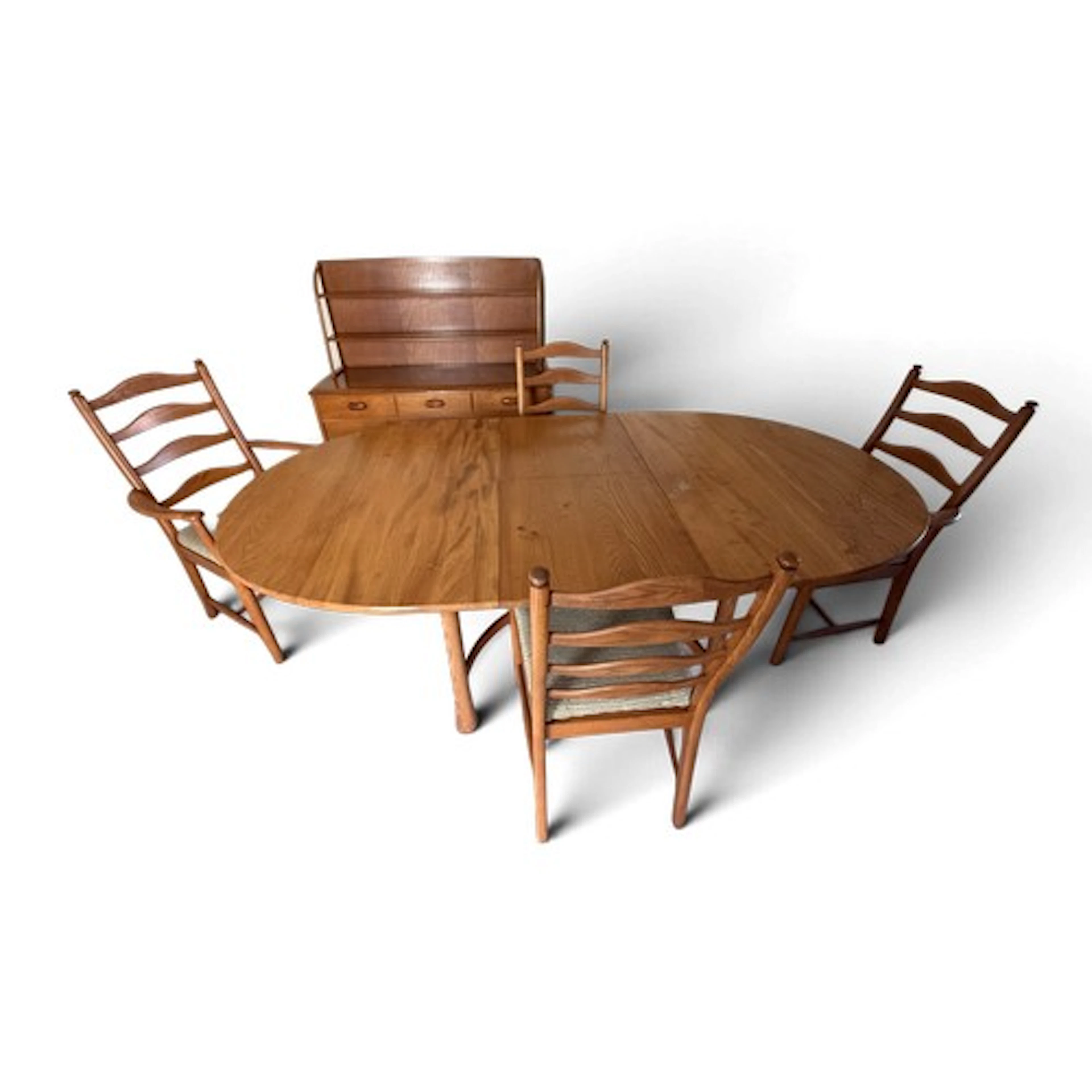 An Ercol Saville extending dining table and chairs 163 l x 1...