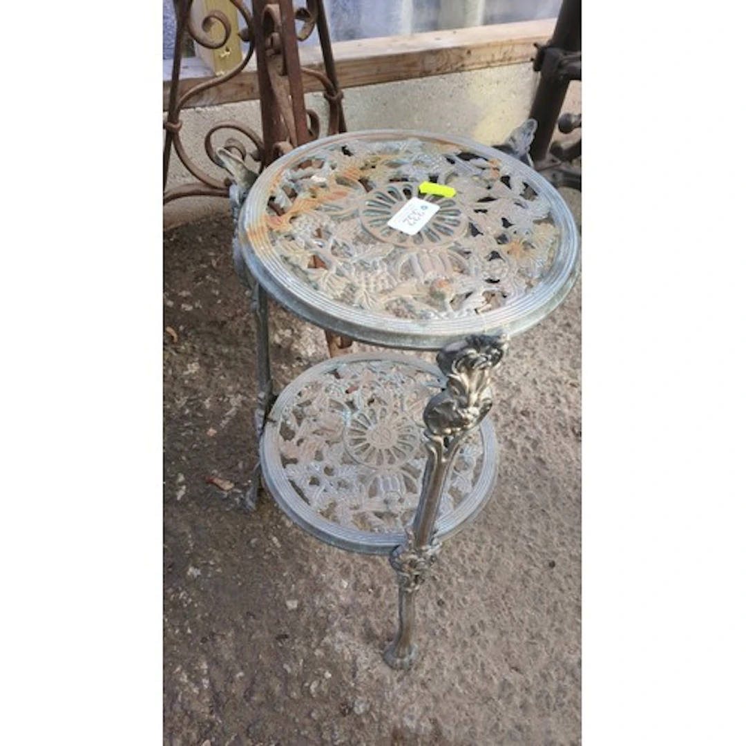 Victorian-style cast-metal two-tier plant stand.