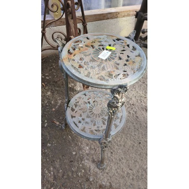 Victorian-style cast-metal two-tier plant stand.