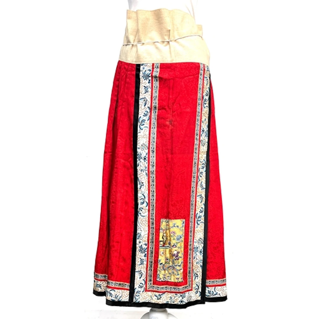 An antique Chinese cotton and red damask silk wrap skirt wit...
