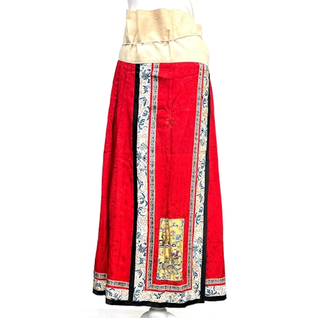 An antique Chinese cotton and red damask silk wrap skirt wit...