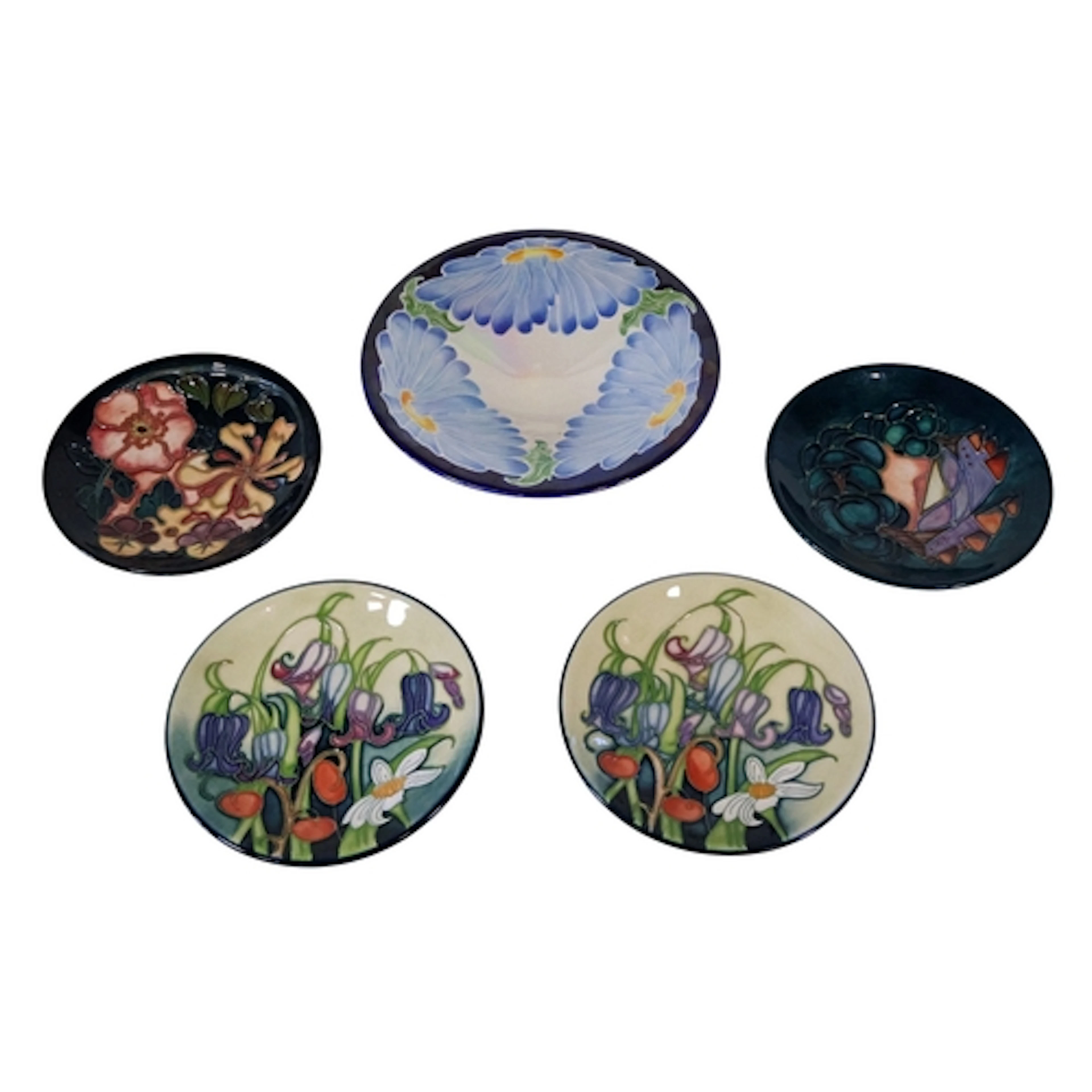 Four Moorcroft pin dishes in the Oberon, Bluebelle and Mamou...