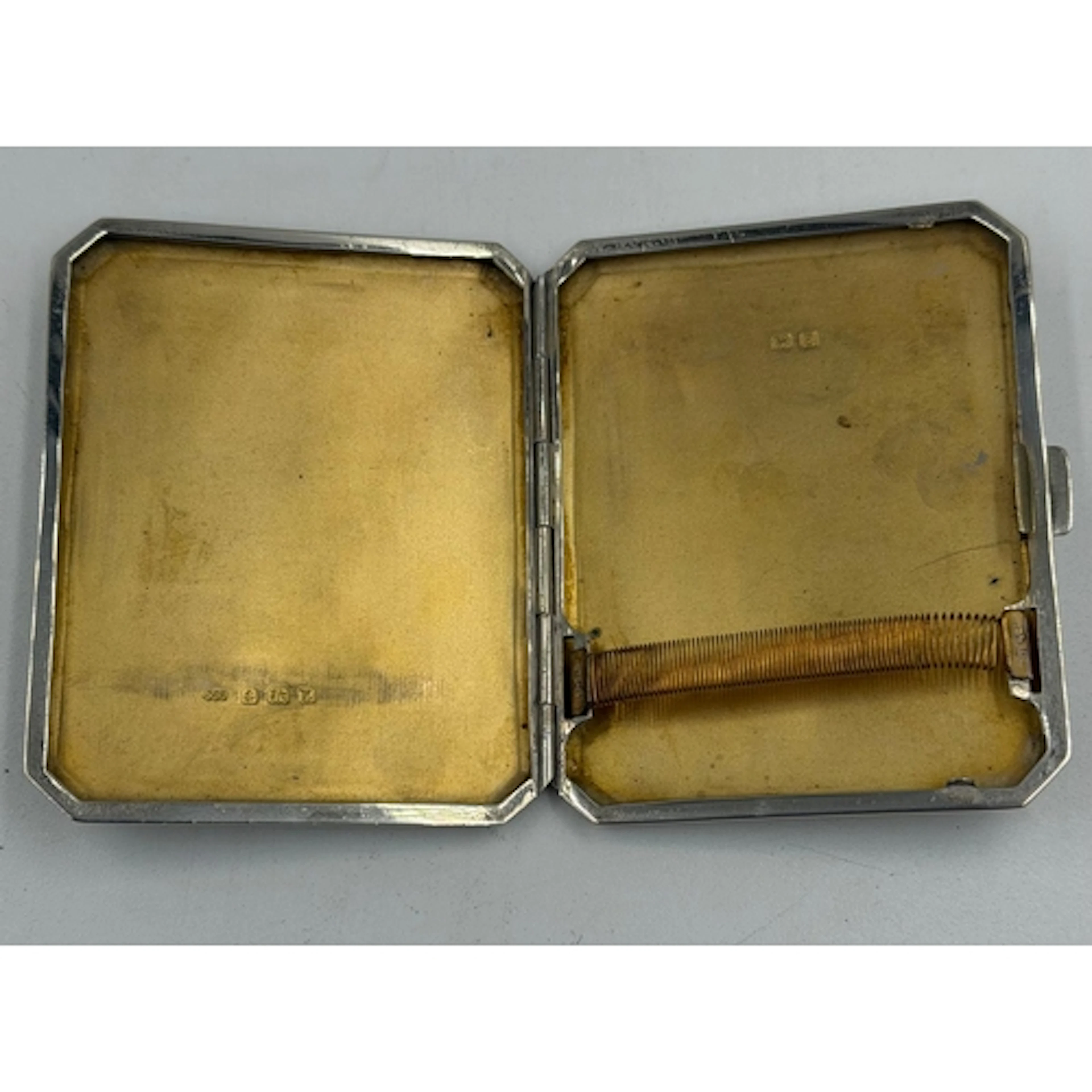 A hallmarked silver cigarette case, approximate weight 89g a...