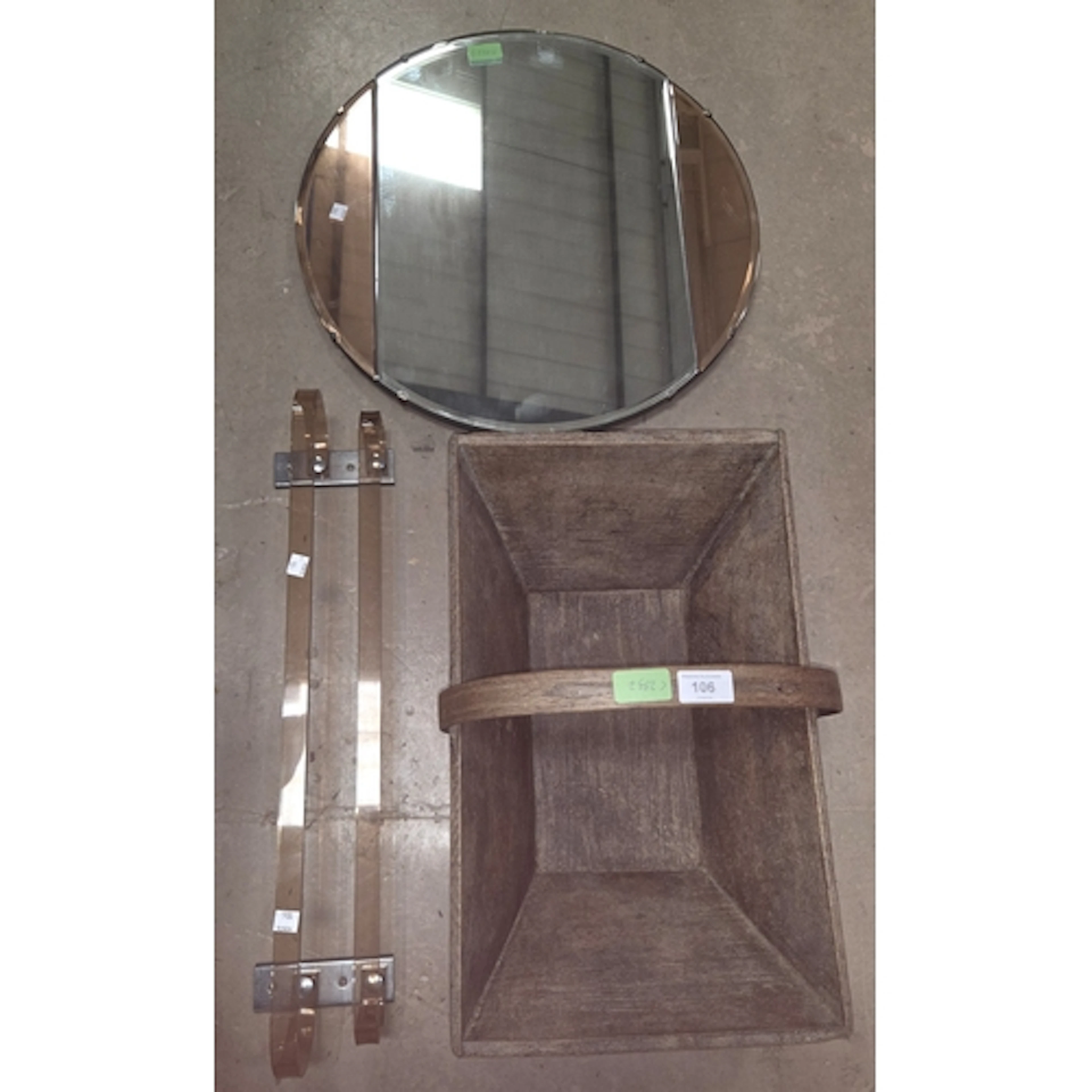 A circular Art Deco mirror with peach side pieces; an Art De...