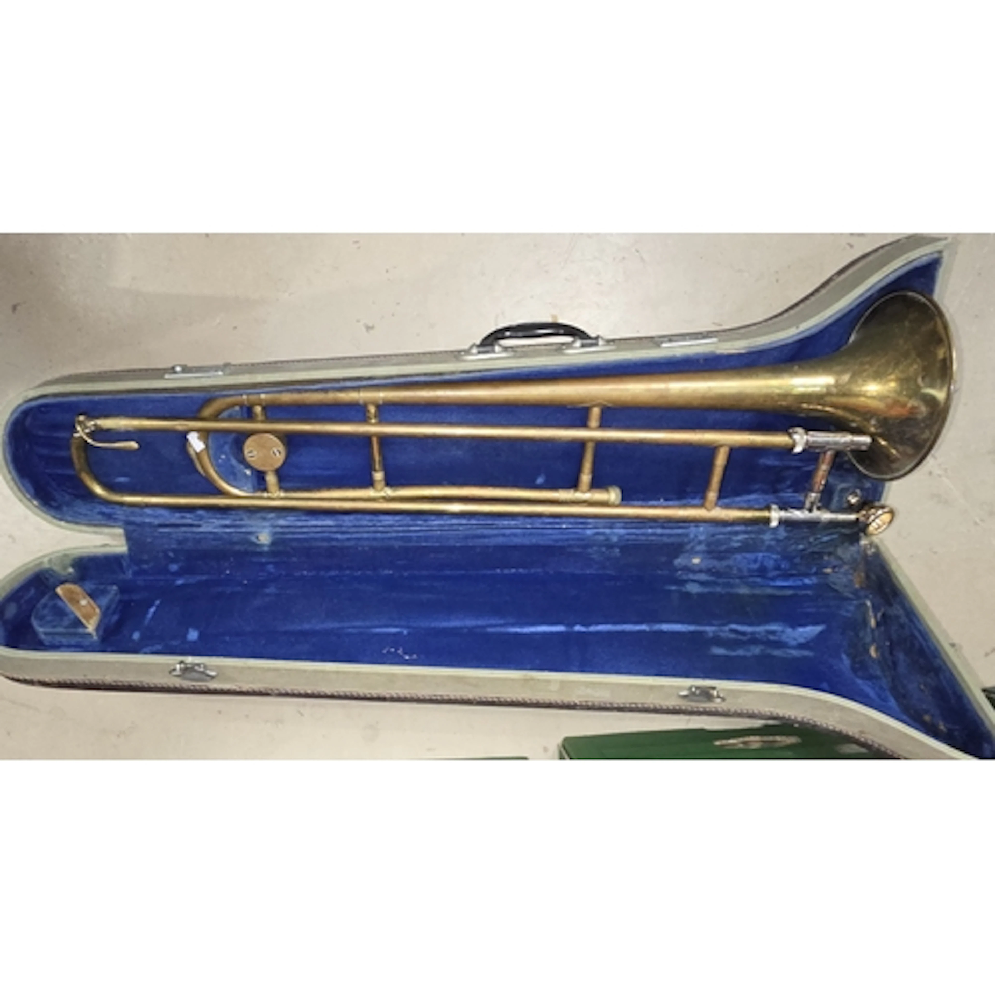 Antique brass trombone with carry case.