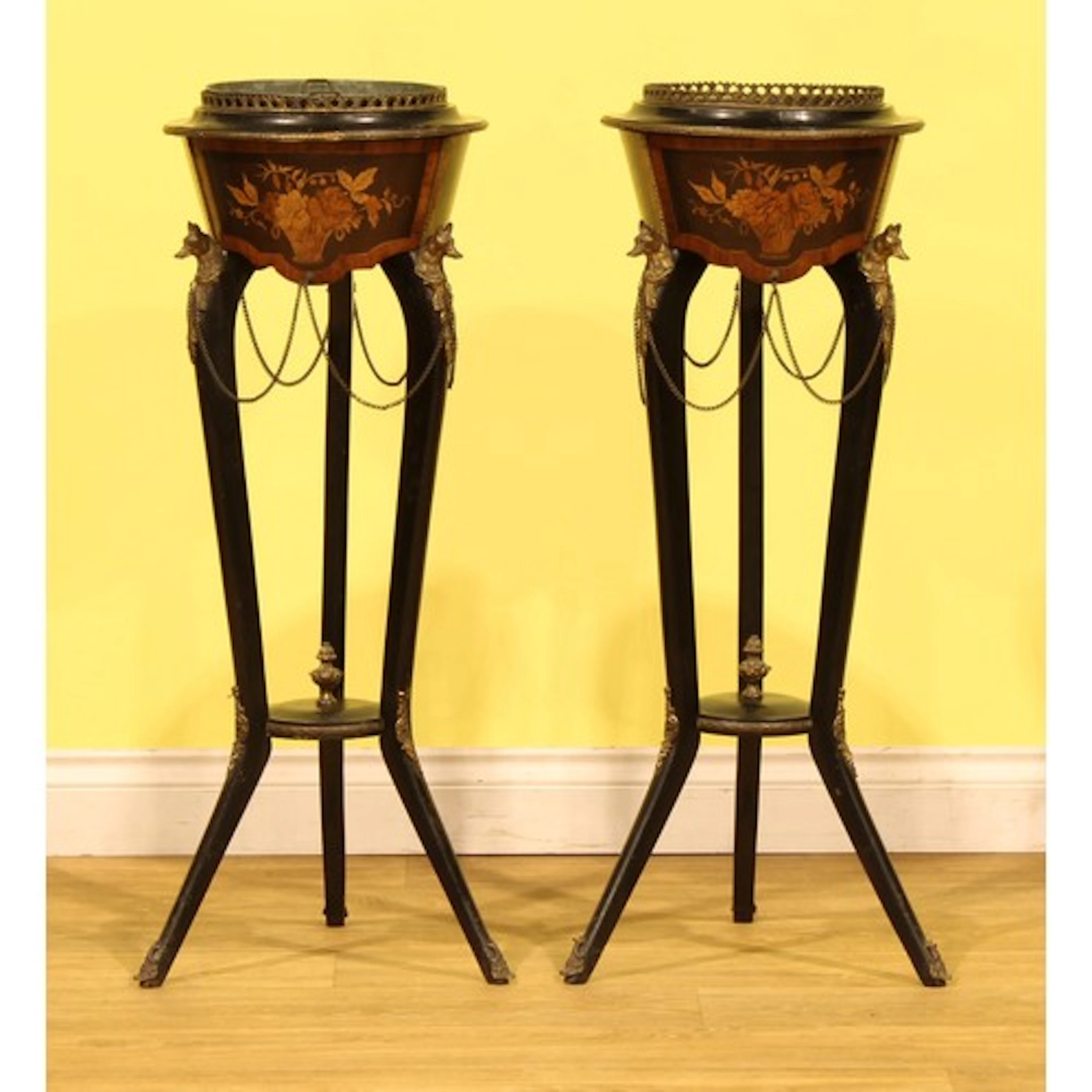 A pair of French gilt metal mounted ebonised and marquetry j...