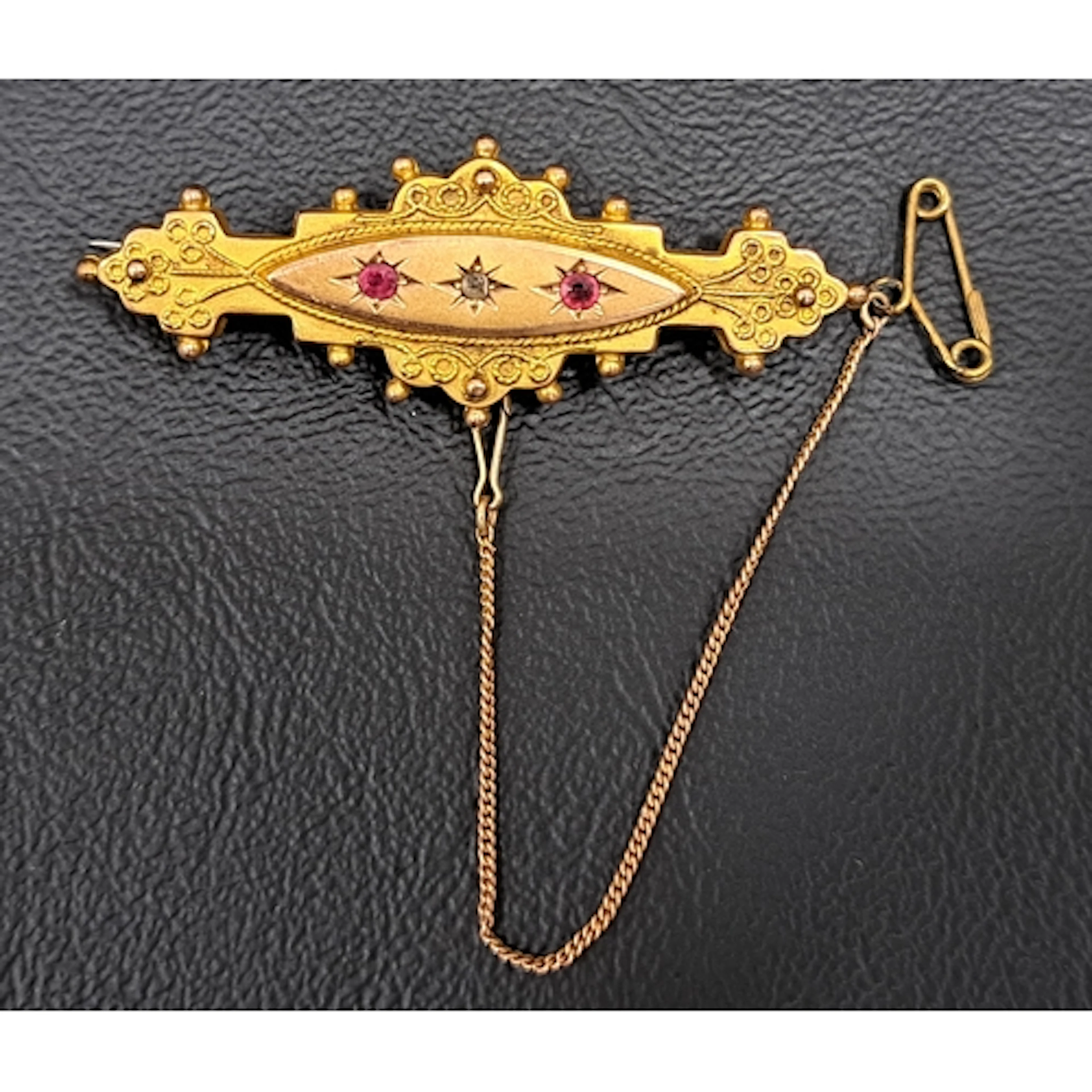 EDWARDIAN DIAMOND AND RED GEM SET BROOCH the central diamond...