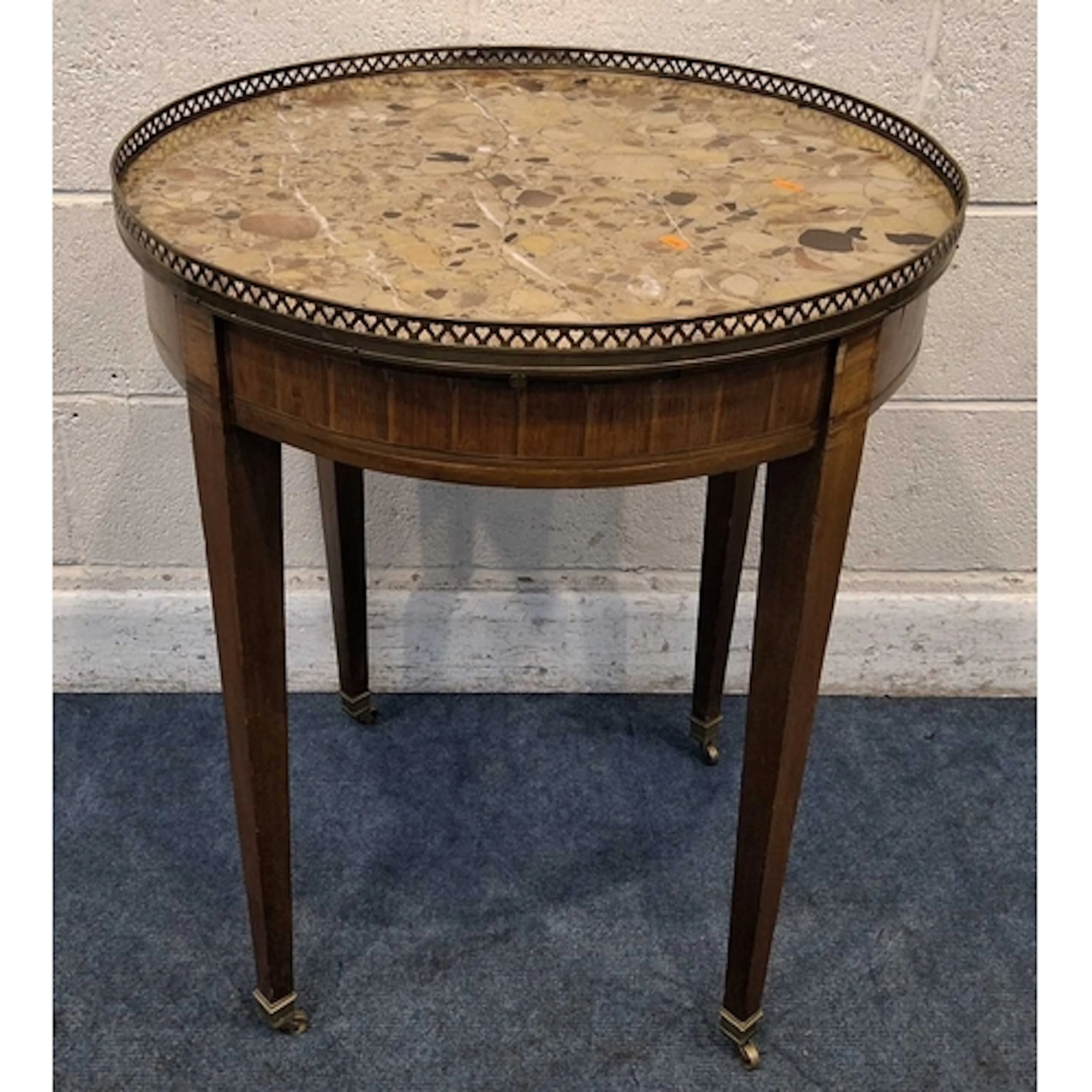 A LOUIS XVI STYLE CIRCULAR BOUILLOTTE TABLE, with a marble i...