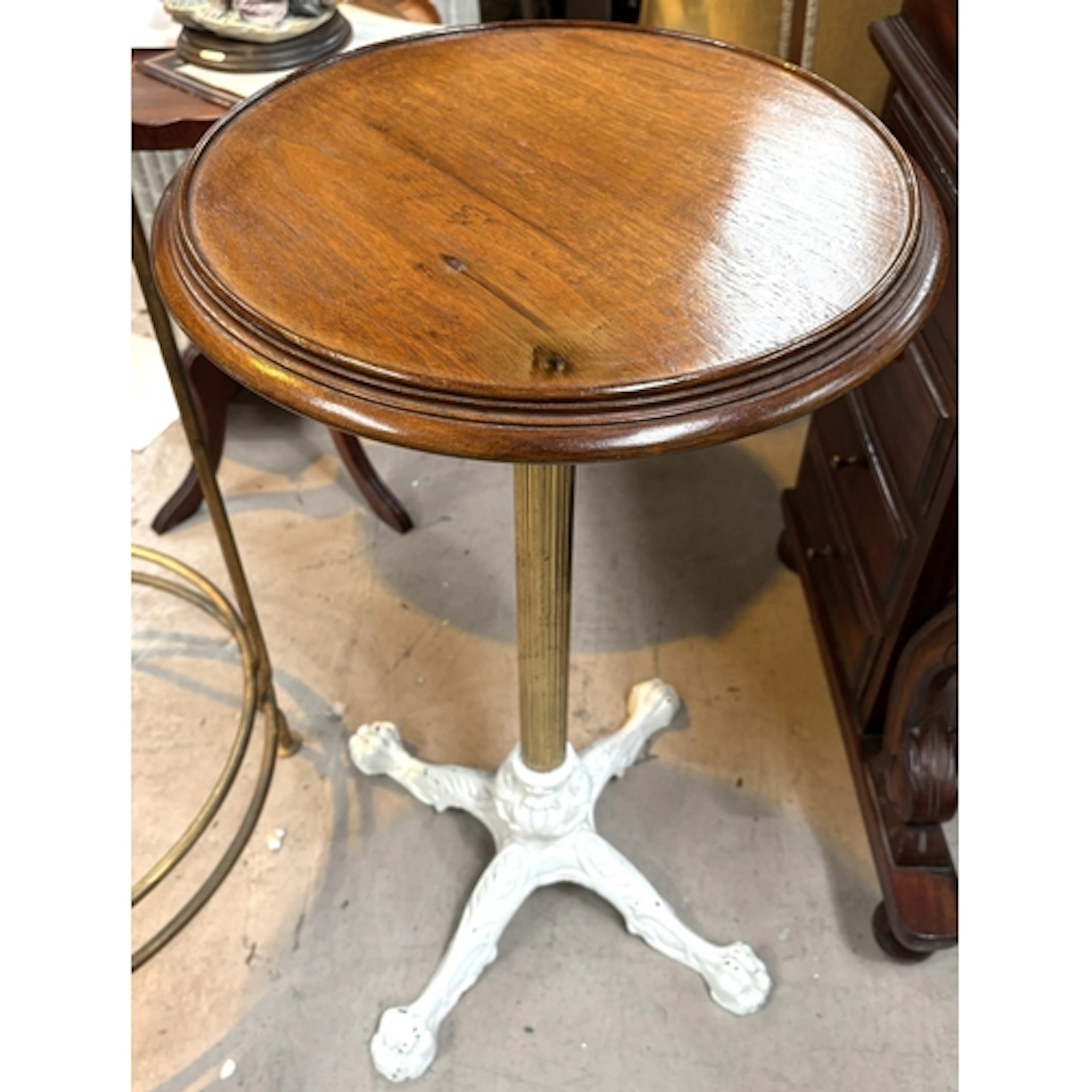An unusual occasional table with cast iron base, reeded bras...