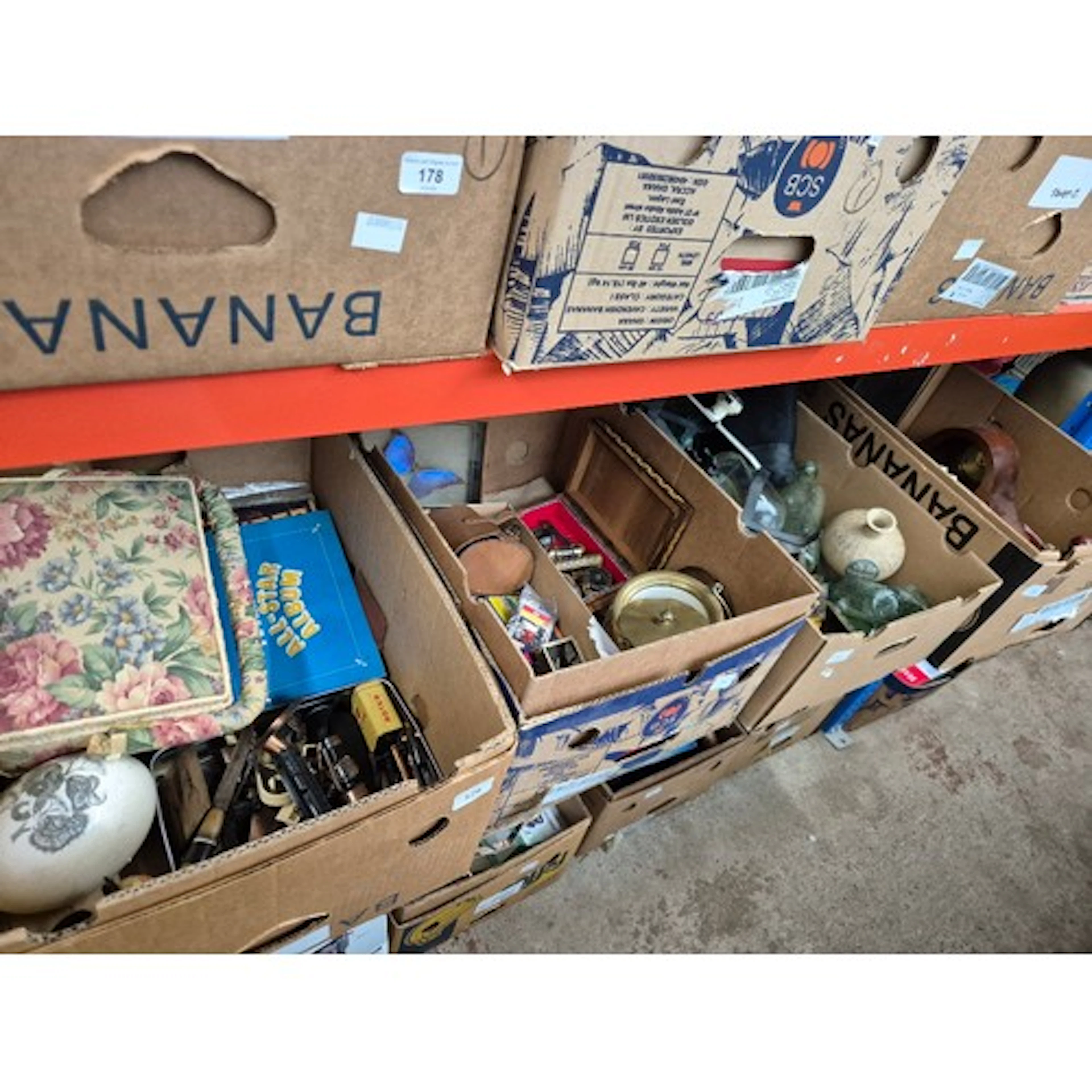 Four boxes of mixed items to include mantle clock, brush/mir...