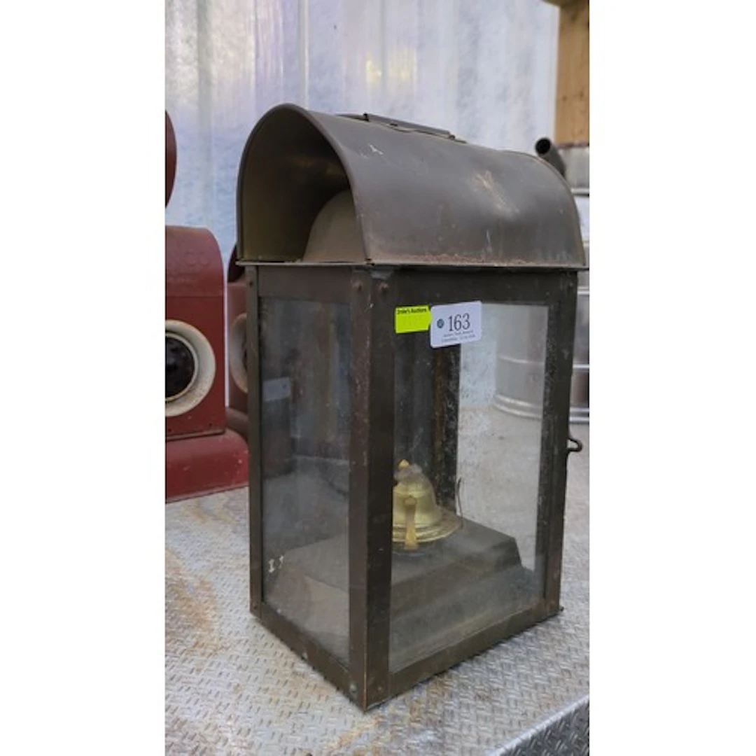 English oil lantern with a rectangular glazed metal case sta...