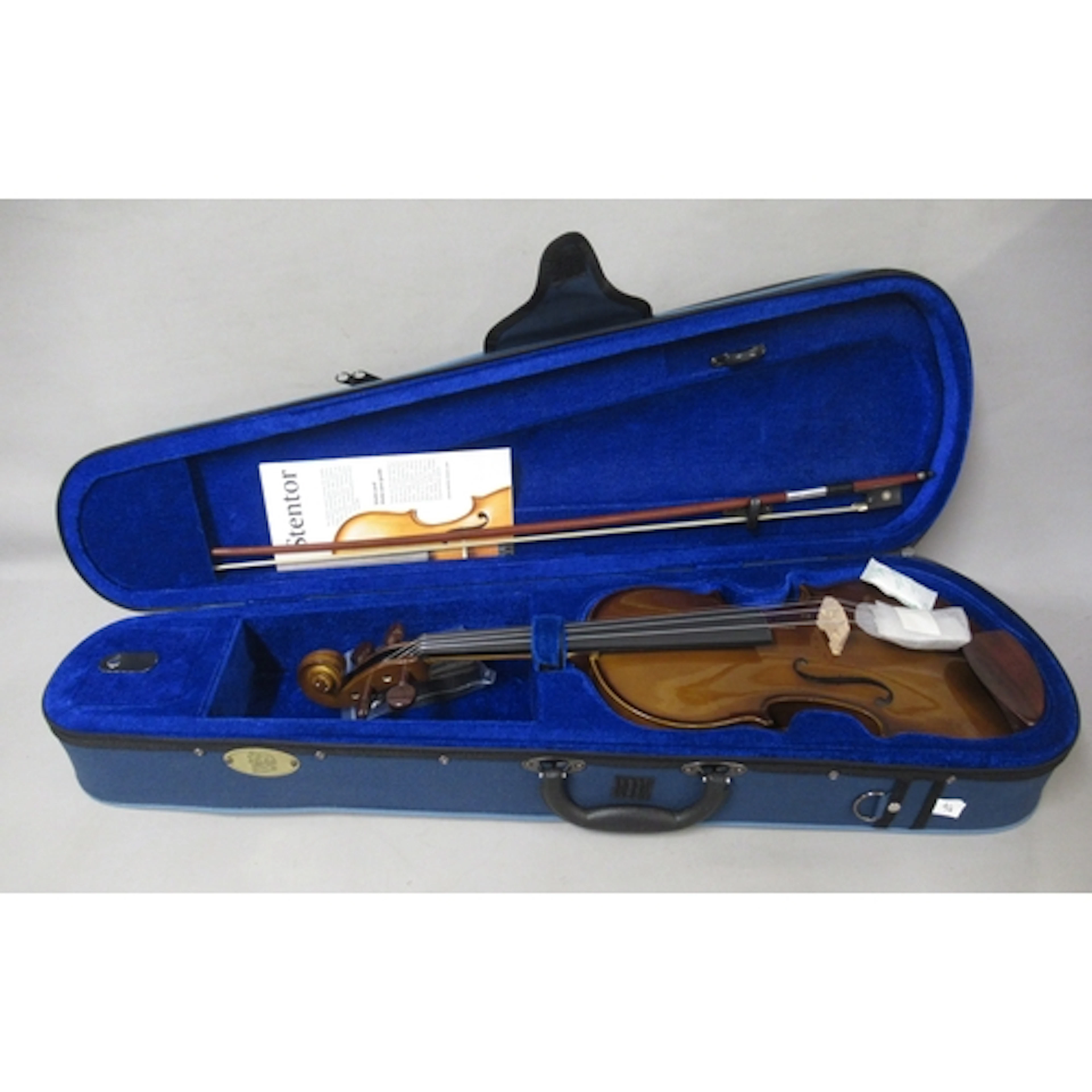 Two modern violins in cases (as new) and another black music...