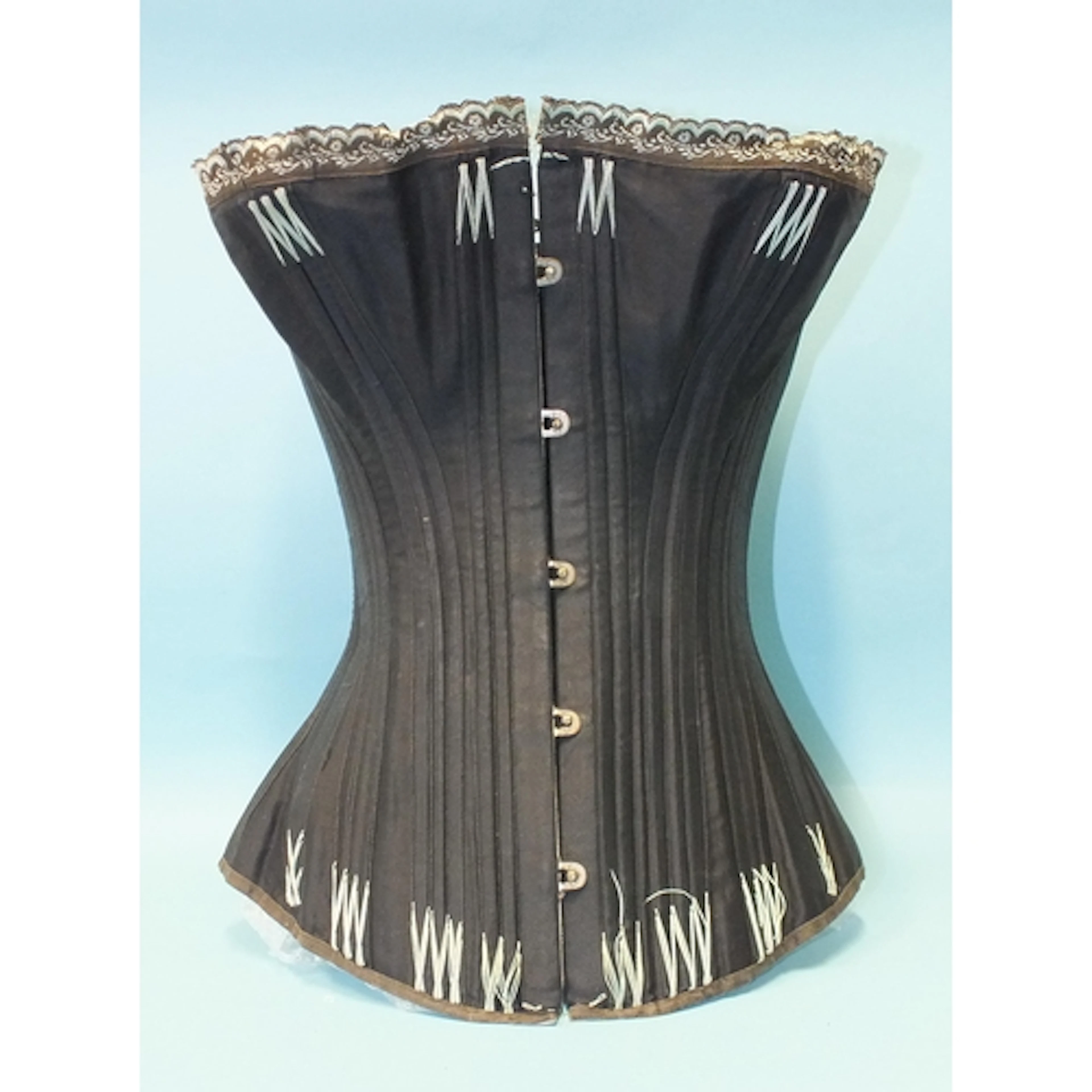 A Victorian "Heliotype" corset by 'C.B.', of black cotton sa...