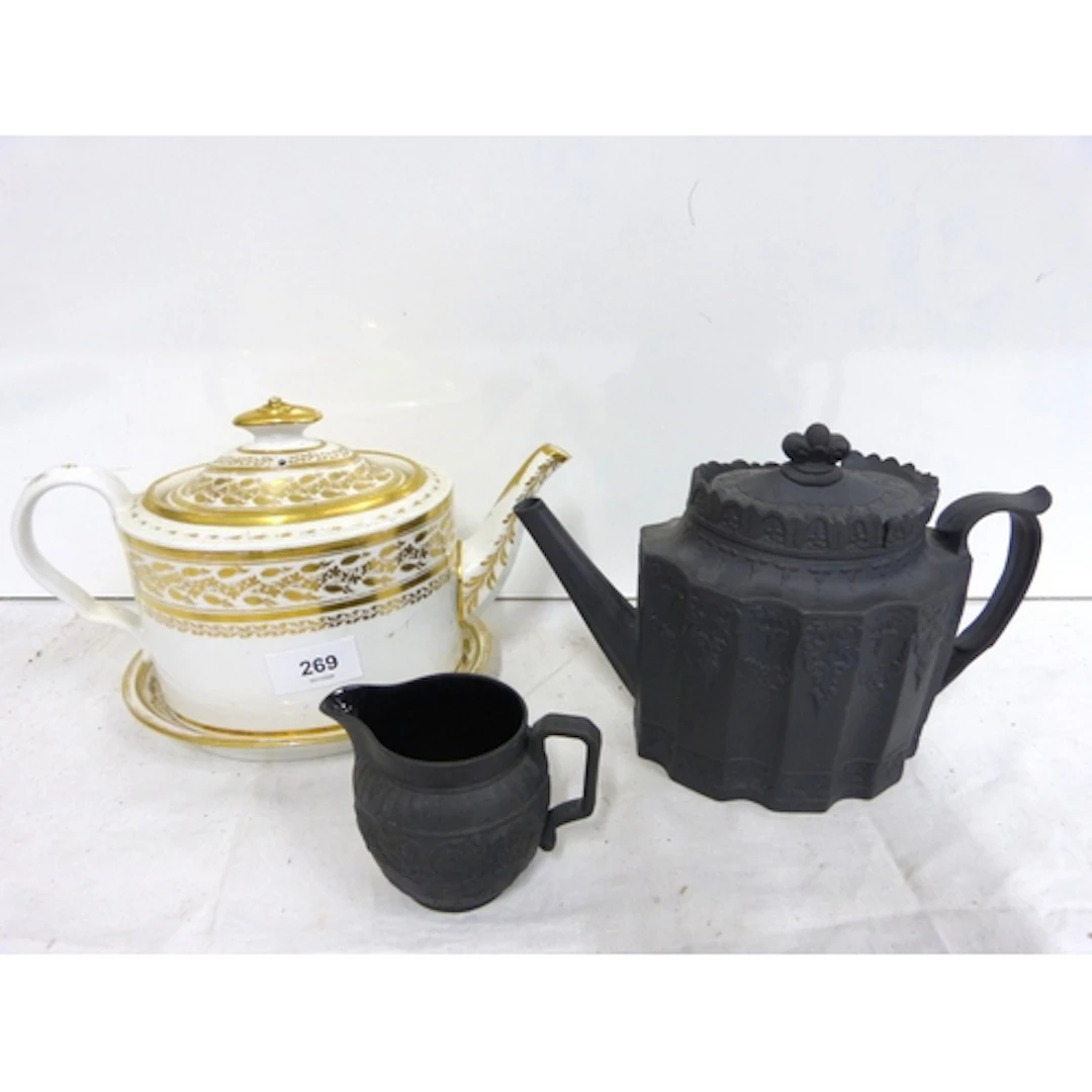 19th gilt decorated ceramic teapot on stand also a black Bas...