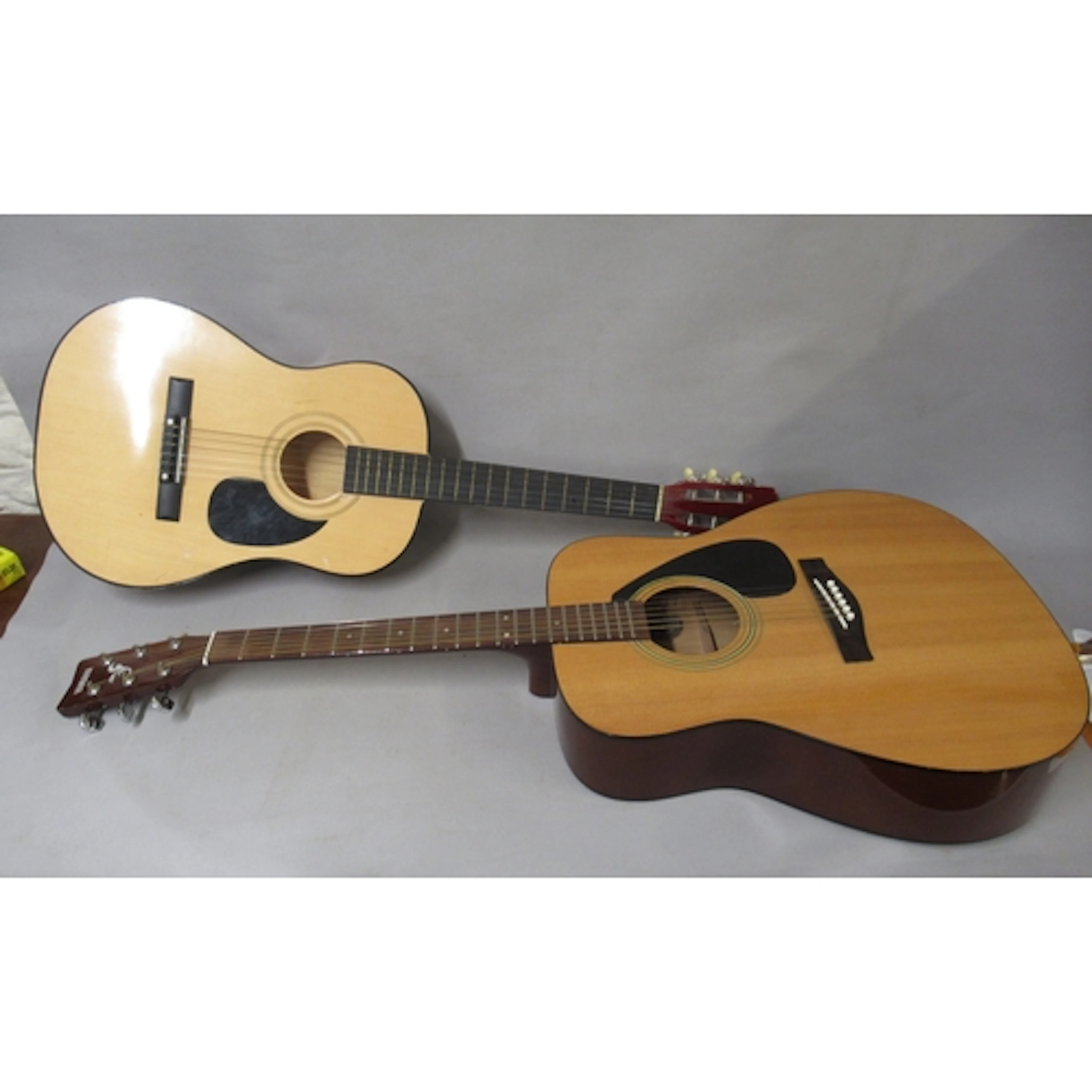 Yamaha F310 acoustic guitar, together with a child's acousti...
