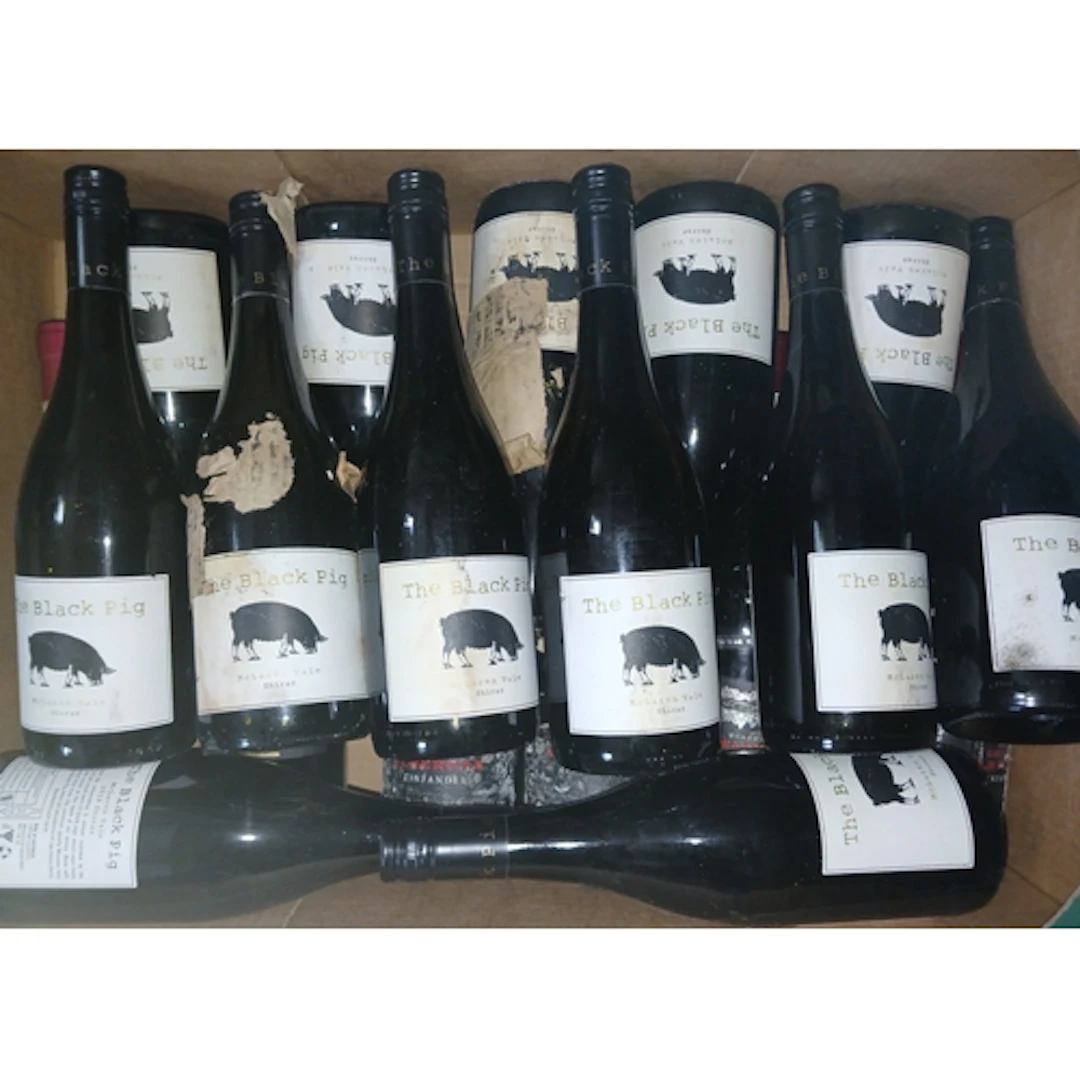 Four boxes of assorted red wines.