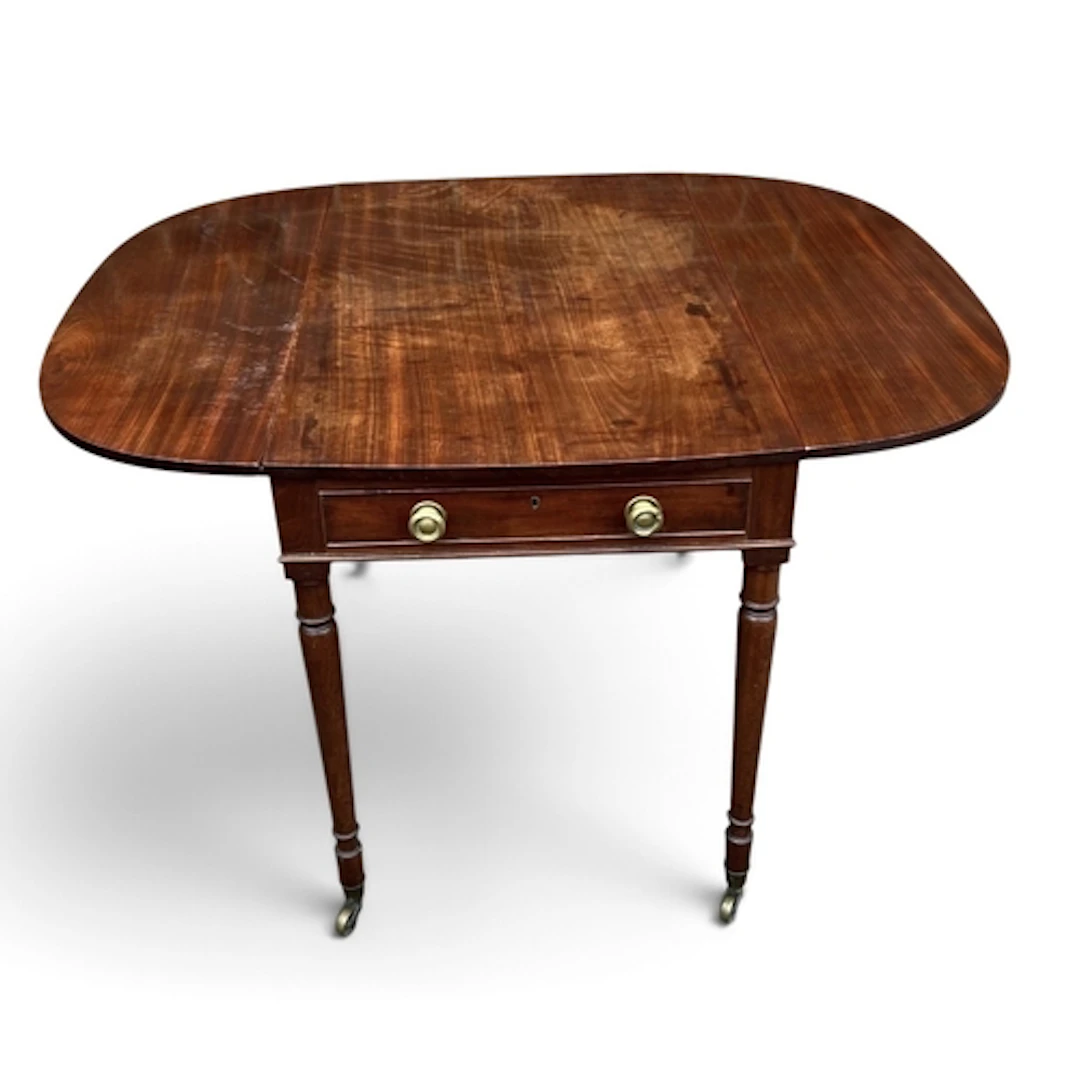 A REGENCY MAHOGANY PEMBROKE TABLE With end drawer, on turned...