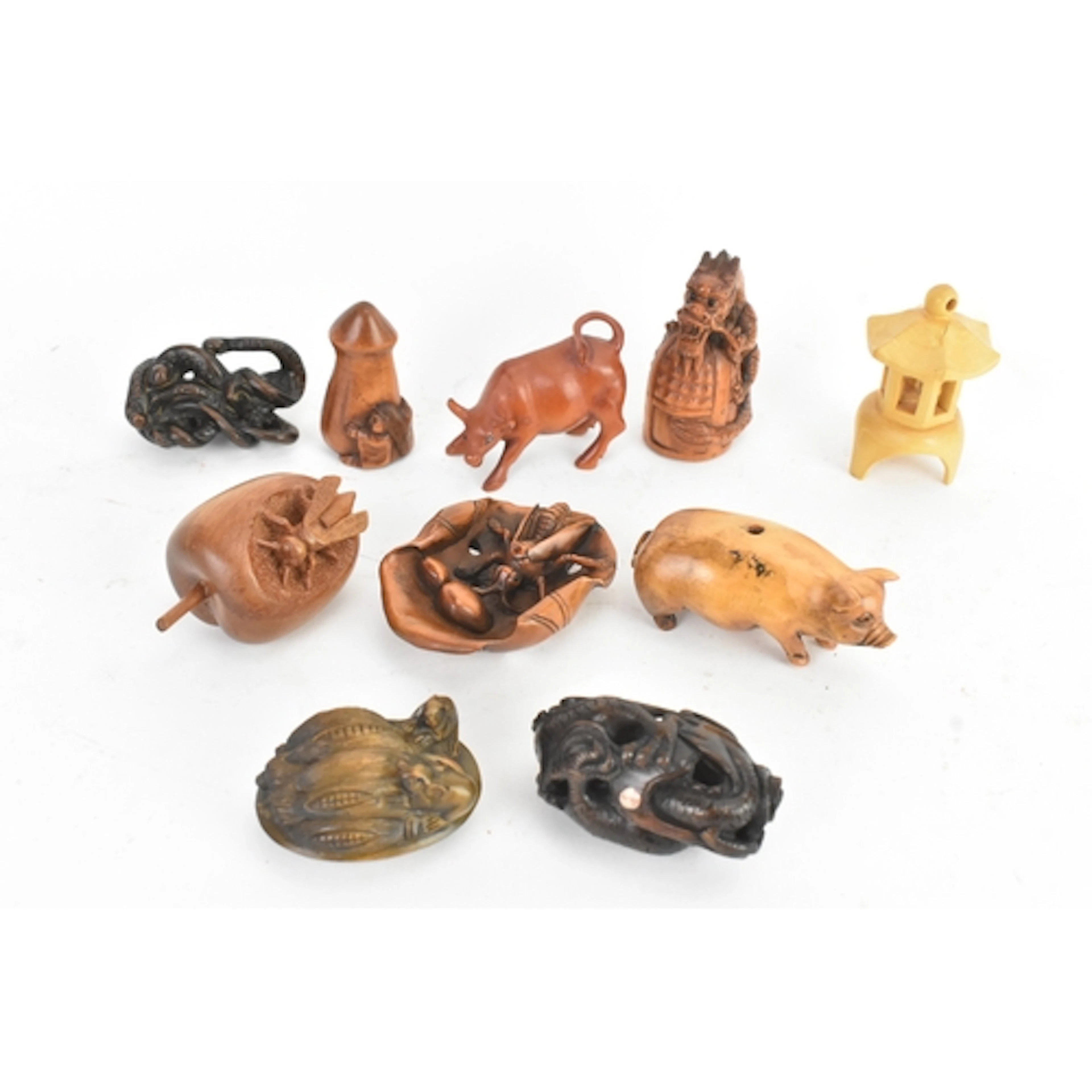 A collection of ten Japanese 20th century netsukes, to inclu...