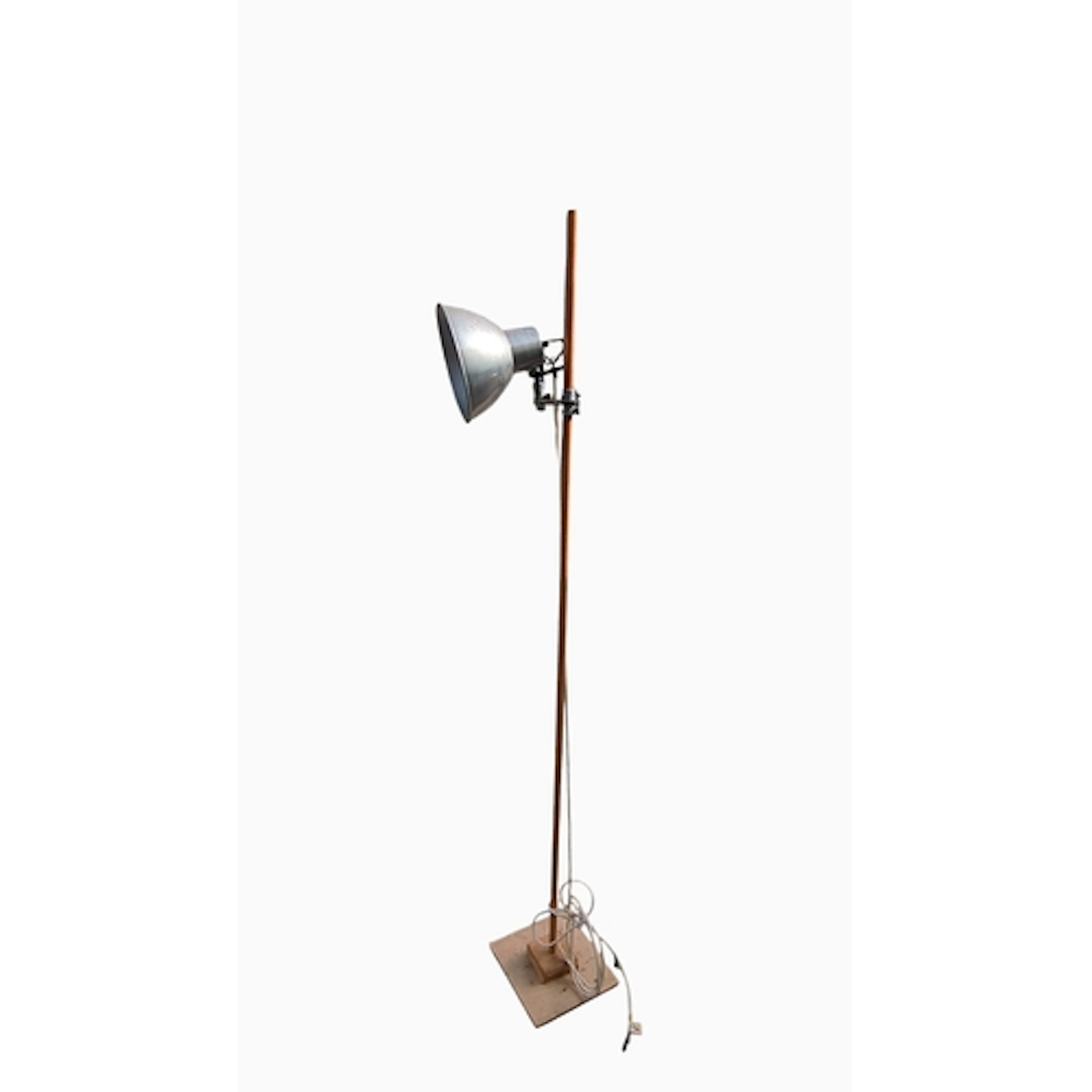 Industrial-style floor lamp with a broad metal reflector and...